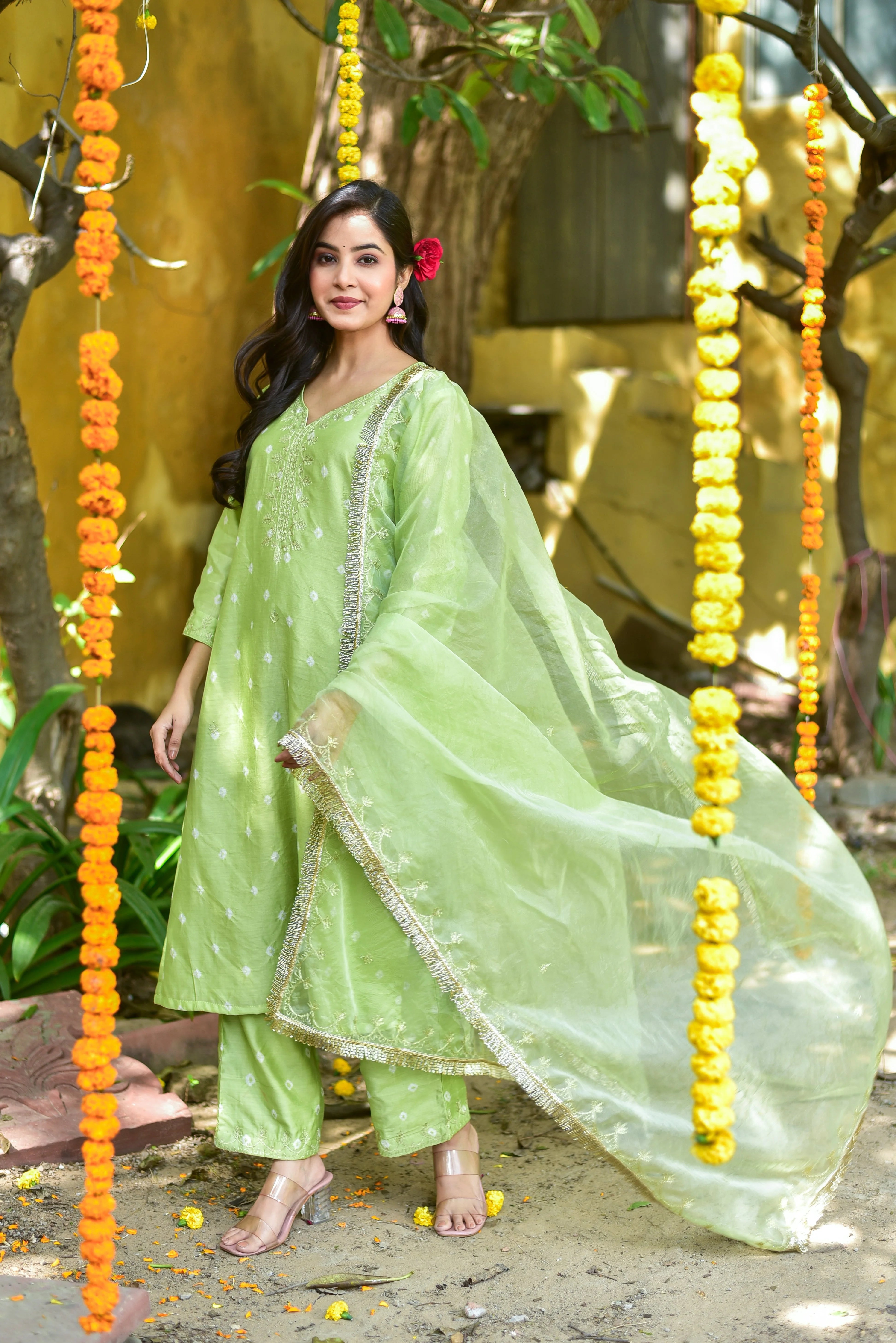 Embracing Fresh Elegance: A Green Bandhej A-Line Kurta Set
The Green Bandhej A-Line Kurta Set is a stunning representation of traditional tie-dye artistry, presented in a soothing mint-green hue. This elegant ensemble is perfect for adding a touch of grace and charm to your festive occasions.
Key Design Highlights:
Exquisite A-Line Silhouette: The kurta features an A-line silhouette, which flatters the figure and creates a beautiful, flowing drape.