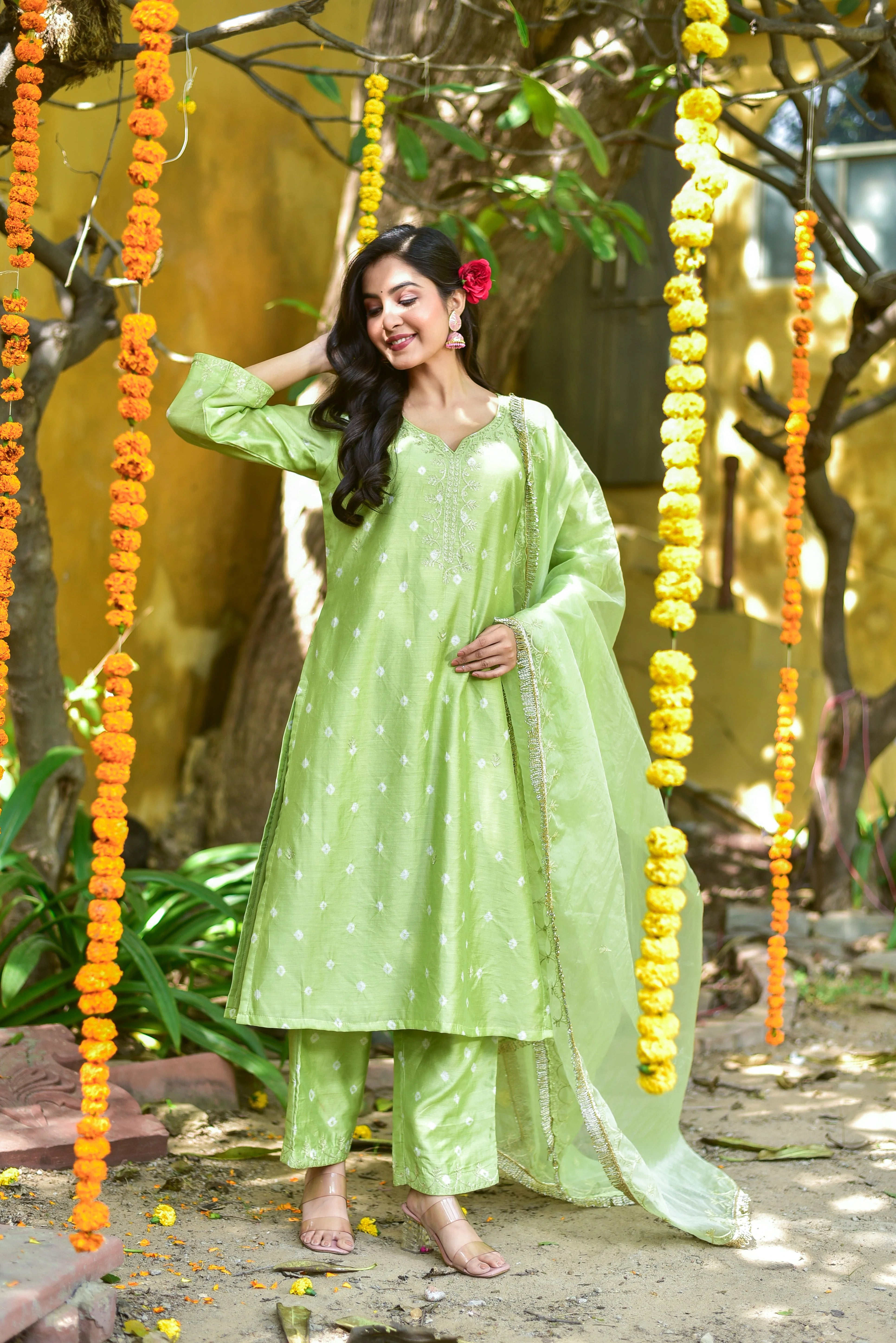 The Green Bandhej A-Line Kurta Set is a stunning ensemble that embodies the essence of traditional Indian craftsmanship. This exquisite piece features a soothing mint-green hue, adorned with intricate bandhej tie-dye patterns that add a touch of elegance to the overall design.
Key Features:
A-Line Silhouette: The kurta boasts a classic A-line silhouette, flaring out from the waist to create a flattering and feminine shape.
