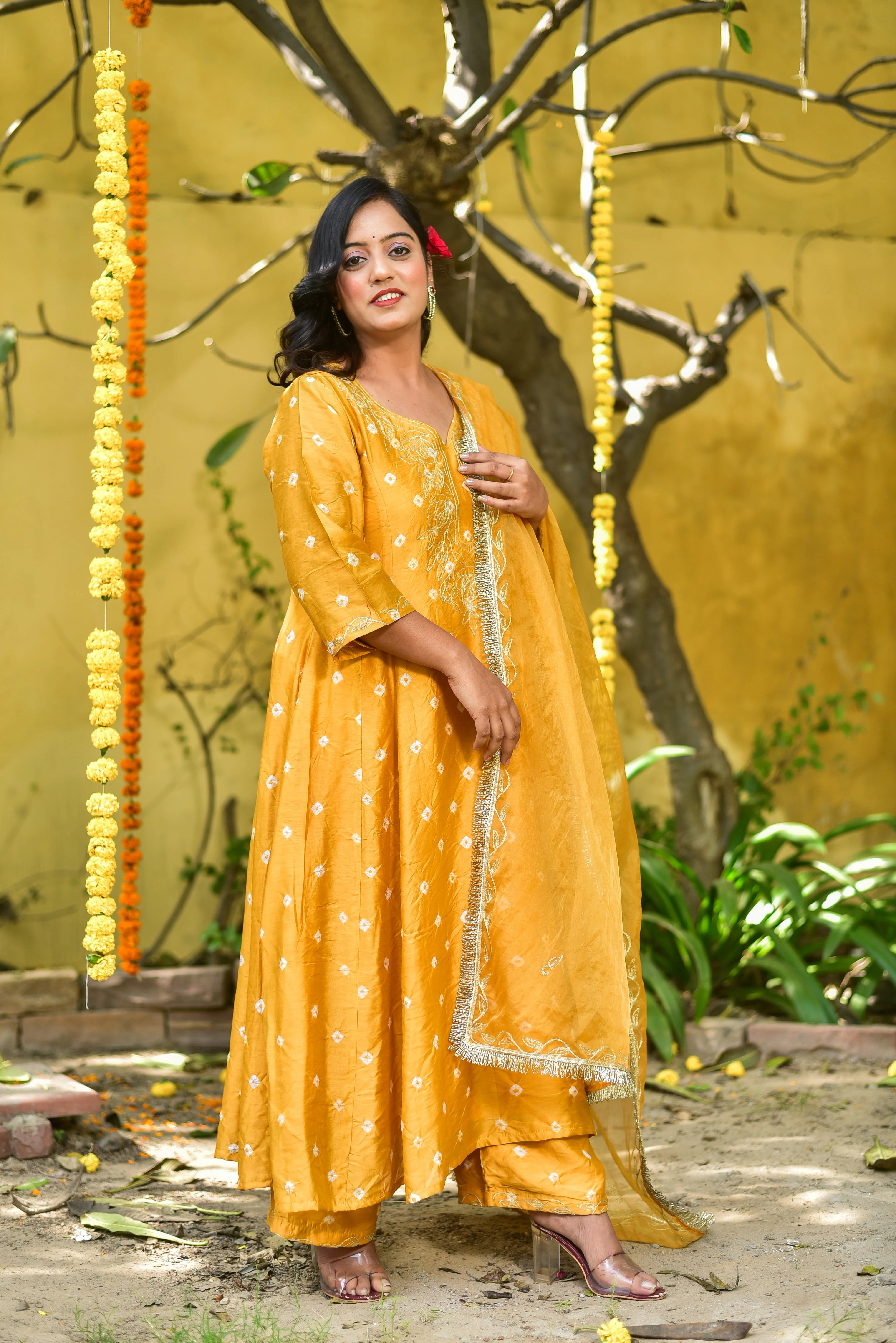 Mustard Yellow Bhandej Kurta Set: A Vibrant Celebration of Tradition and Style
This stunning Mustard Yellow Bhandej Kurta Set embodies the essence of traditional Indian craftsmanship and vibrant elegance. The luminous mustard hue, reminiscent of sunshine and joy, makes it an ideal choice for auspicious occasions and festive celebrations.
Key Features:
Traditional Bandhani Craftsmanship: The set showcases intricate bandhani patterns, a testament to the rich cultural heritage of India.