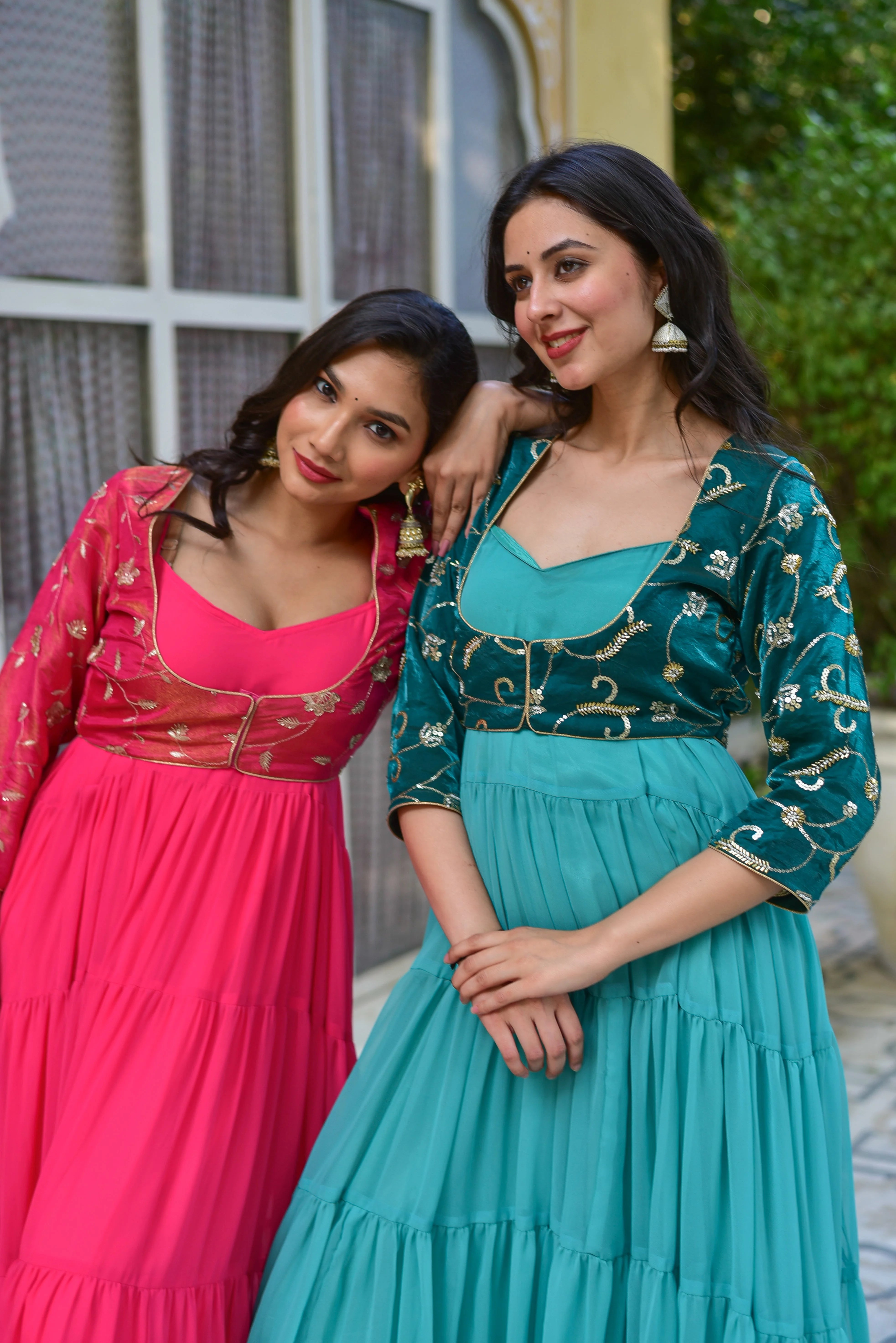 The image showcases a stunning green tiered dress with a matching jacket, exuding elegance and sophistication. The dress features a rich, dark green hue that is accentuated by intricate gold embroidery, adding a touch of luxury to the overall design. The tiered skirt creates a beautiful flowy effect, while the matching jacket adds a pop of color and texture to the outfit.
This dress is perfect for making a statement at any formal occasion, from weddings to red-carpet events.