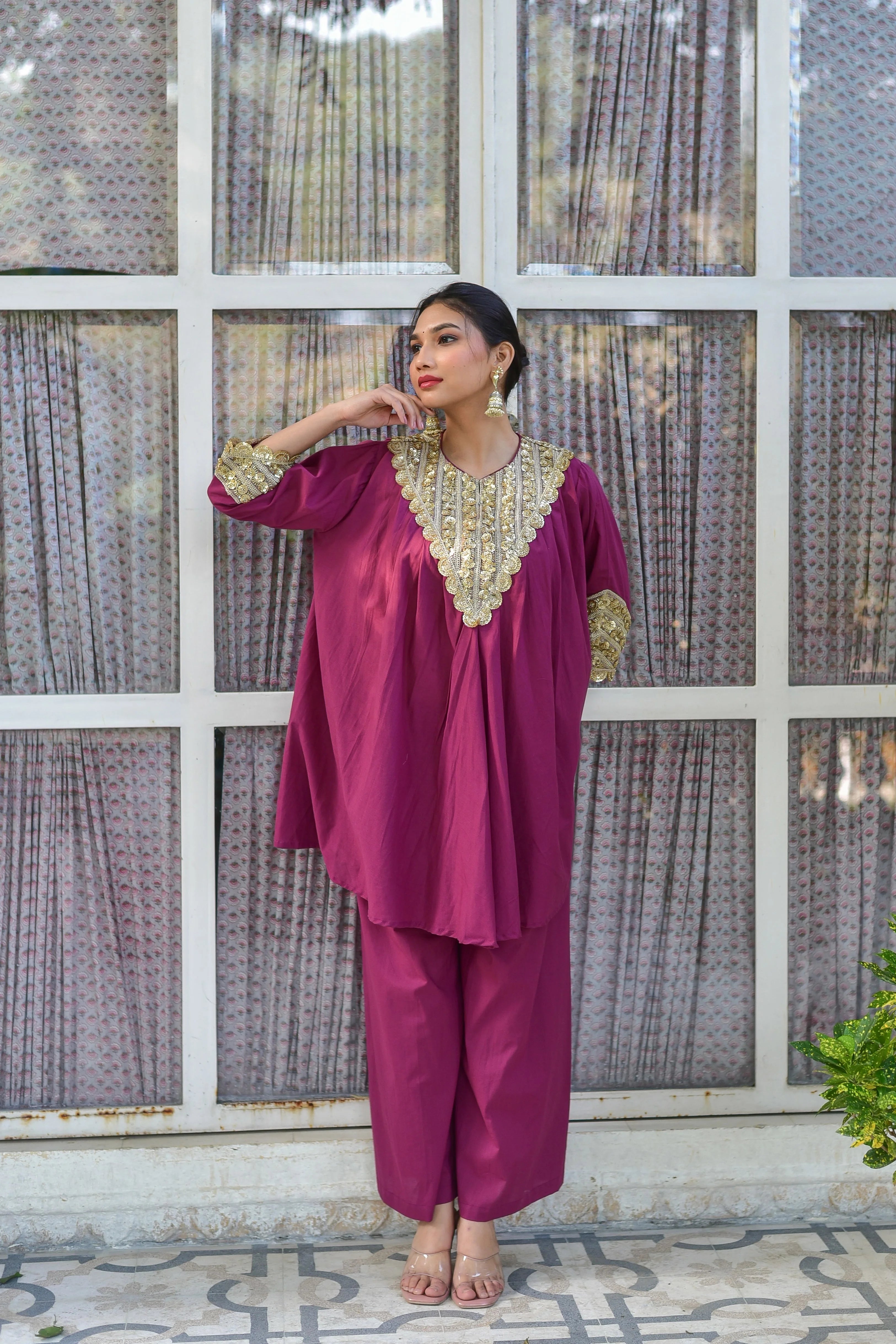 The Mulberry Gold Glaze Co-Ord Set is a stunning ensemble that exudes effortless elegance. Crafted from 100% pure cotton, this luxurious set drapes beautifully while ensuring all-day comfort and breathability. The vibrant mulberry hue adds a pop of color to any outfit, making it perfect for making a statement at any occasion. The gold glaze accents add a touch of sophistication, elevating the overall look to new heights.