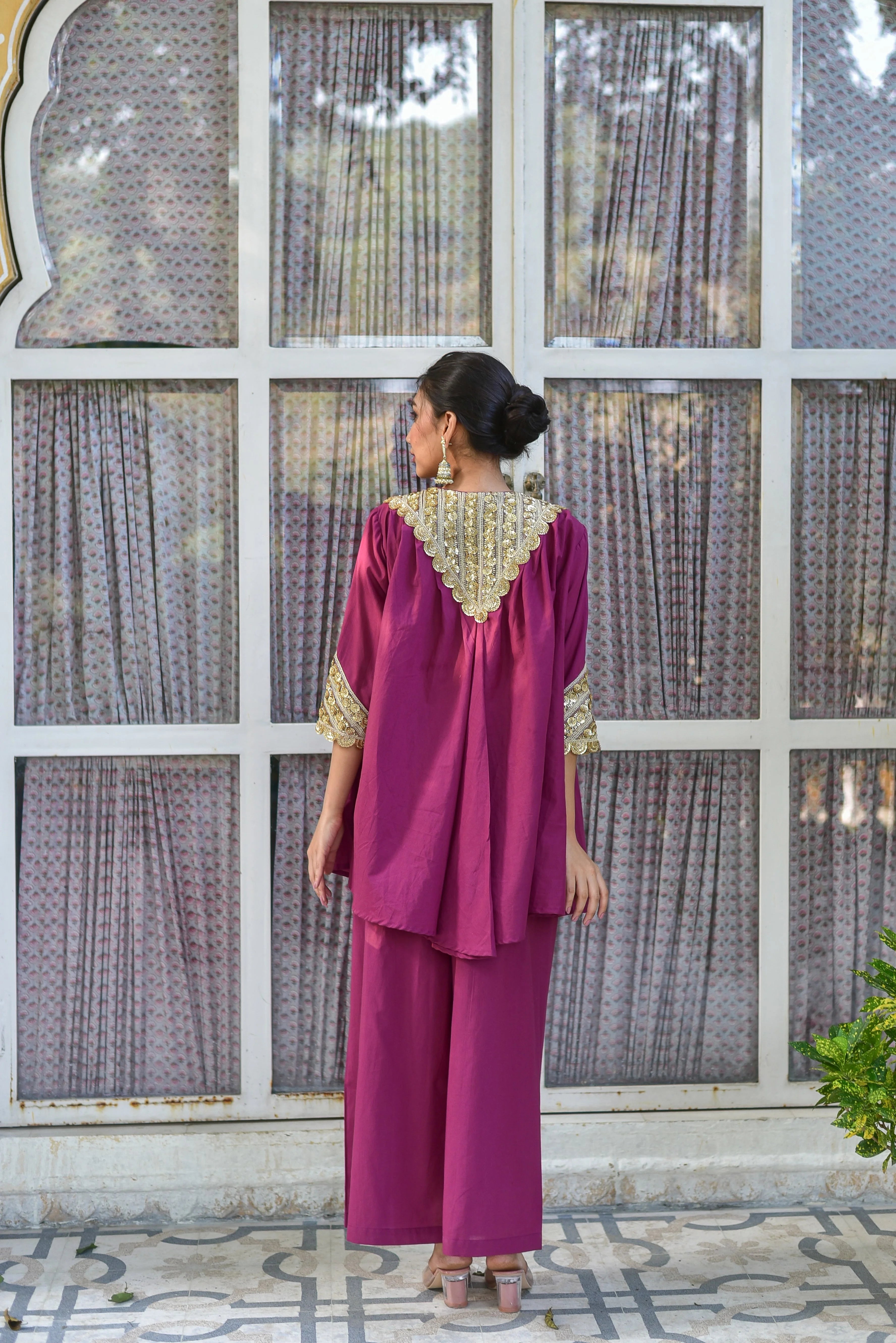 The Mulberry Gold Glaze Co-Ord Set is a stunning ensemble that combines contemporary silhouettes with timeless craftsmanship, crafted from 100% pure cotton for a luxurious feel and all-day comfort. This elegant set features a Mulberry hue and Gold Glaze accents, perfect for making a statement at any occasion. With its trendy design and high-quality materials, this set is sure to be a hit with fashion enthusiasts.