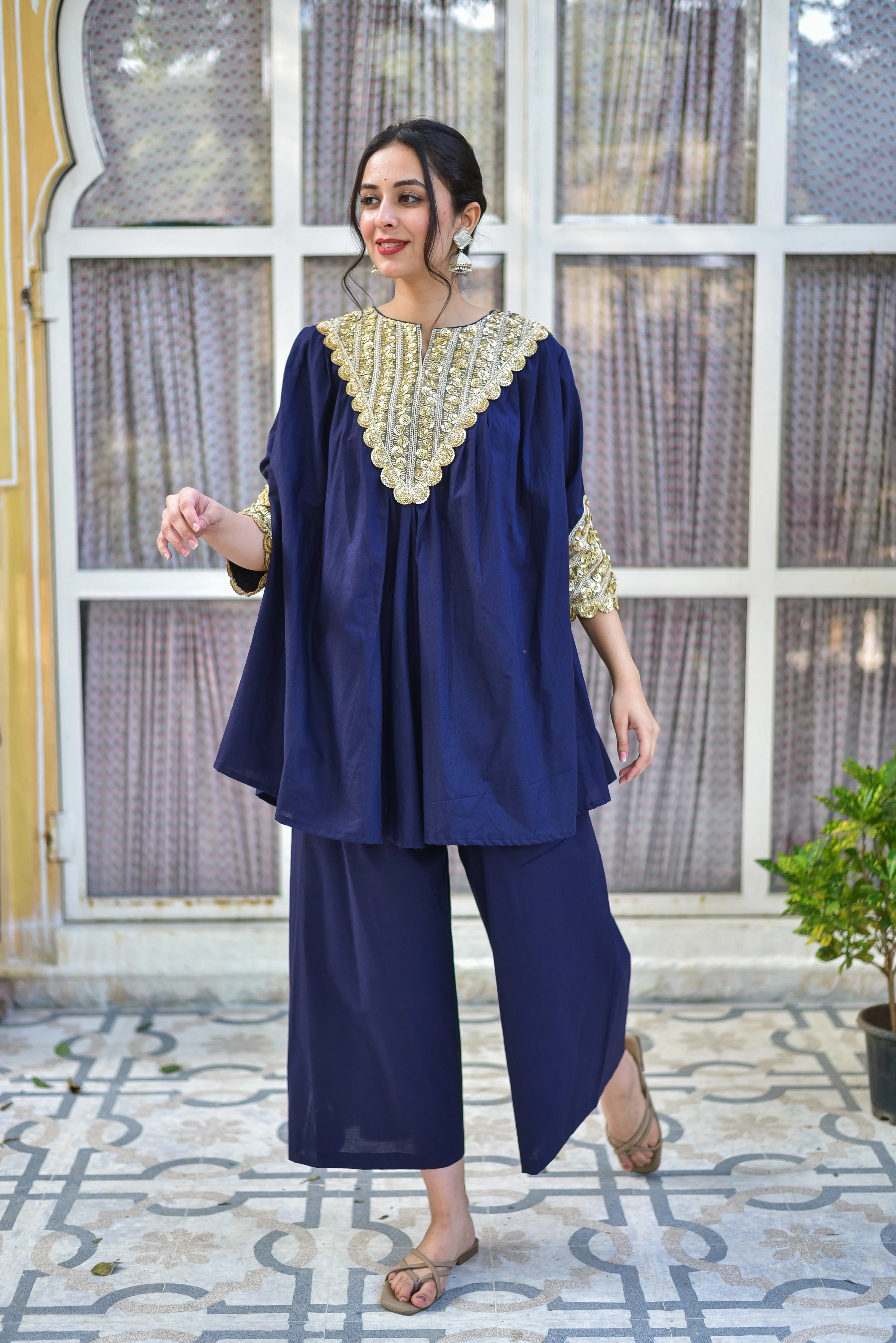 Blueberry Gold Glaze Co-Ord Set
This luxurious ensemble is crafted from 100% pure cotton, offering a comfortable and breathable fit. The rich blue hue is accentuated by intricate gold embroidery, adding a touch of sophistication to the overall design.