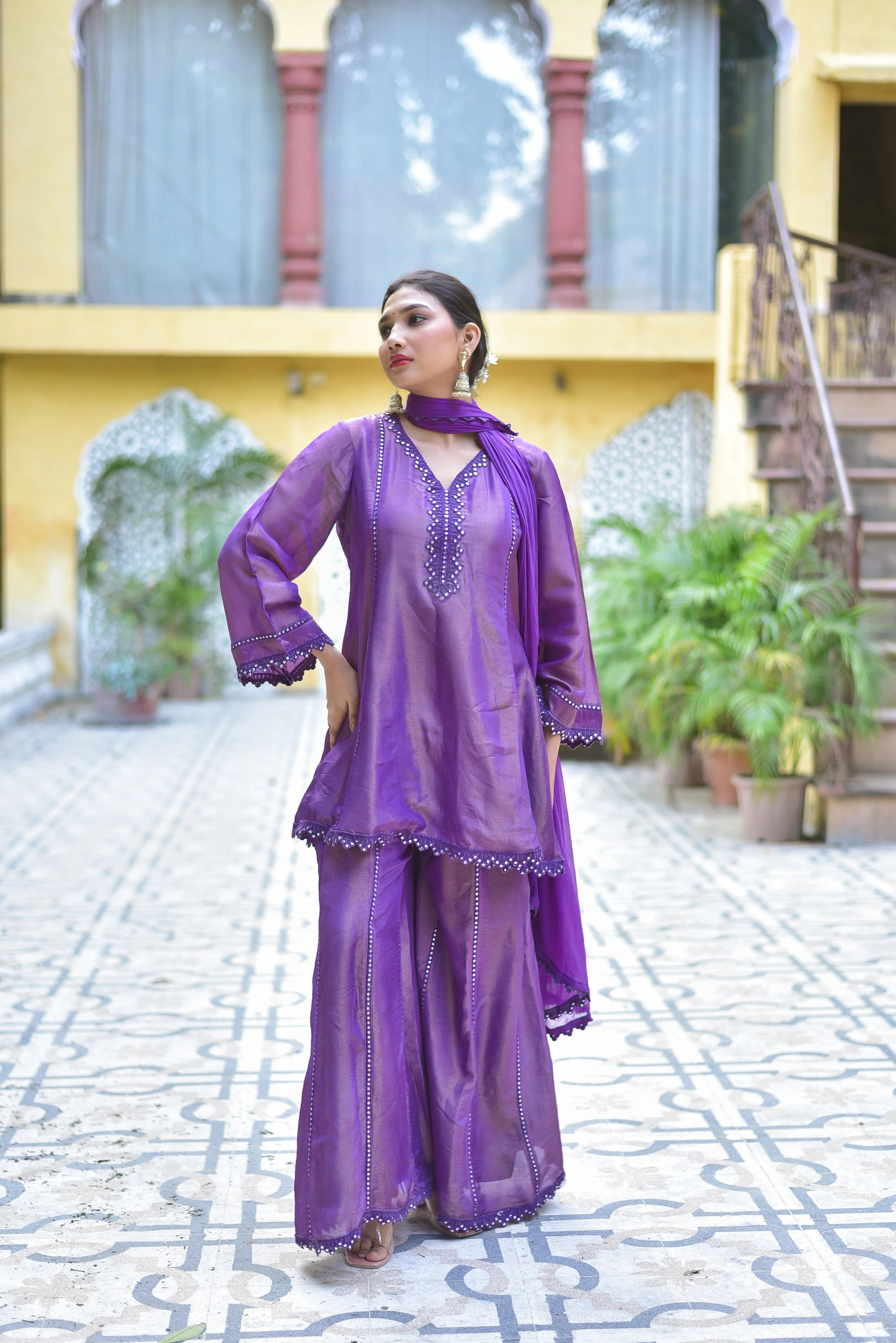 The Purple Zari Silk Kurta Sharara Set: A Timeless Elegance
Experience the epitome of regal luxury with this exquisite Purple Zari Silk Kurta Sharara Set, perfect for festive occasions and special gatherings. The intricate Zari silk fabric, the elegant kurta and sharara style, and the versatile purple color all combine to create a stunning ensemble that exudes timeless elegance and sophistication.
