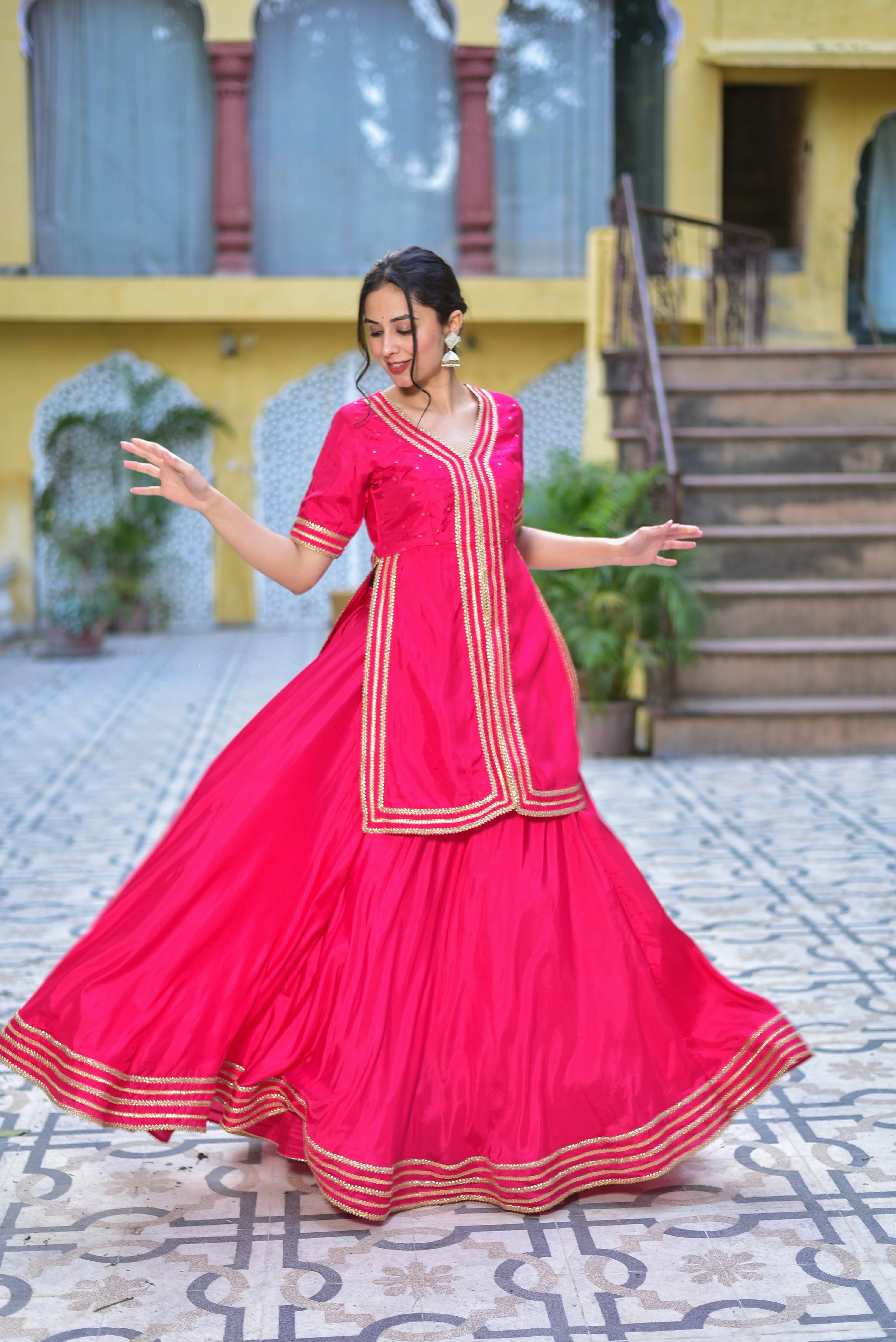 The Pink Rani sa indo-western set is a stunning fusion of traditional elegance and contemporary fashion. Crafted from luxurious silk blend fabric, this ensemble drapes beautifully and feels incredibly soft against your skin. The vibrant pink color adds a touch of modernity to the traditional style, making it perfect for any occasion. With its elegant design and comfortable fit, this set is sure to turn heads and make you feel confident and stylish.