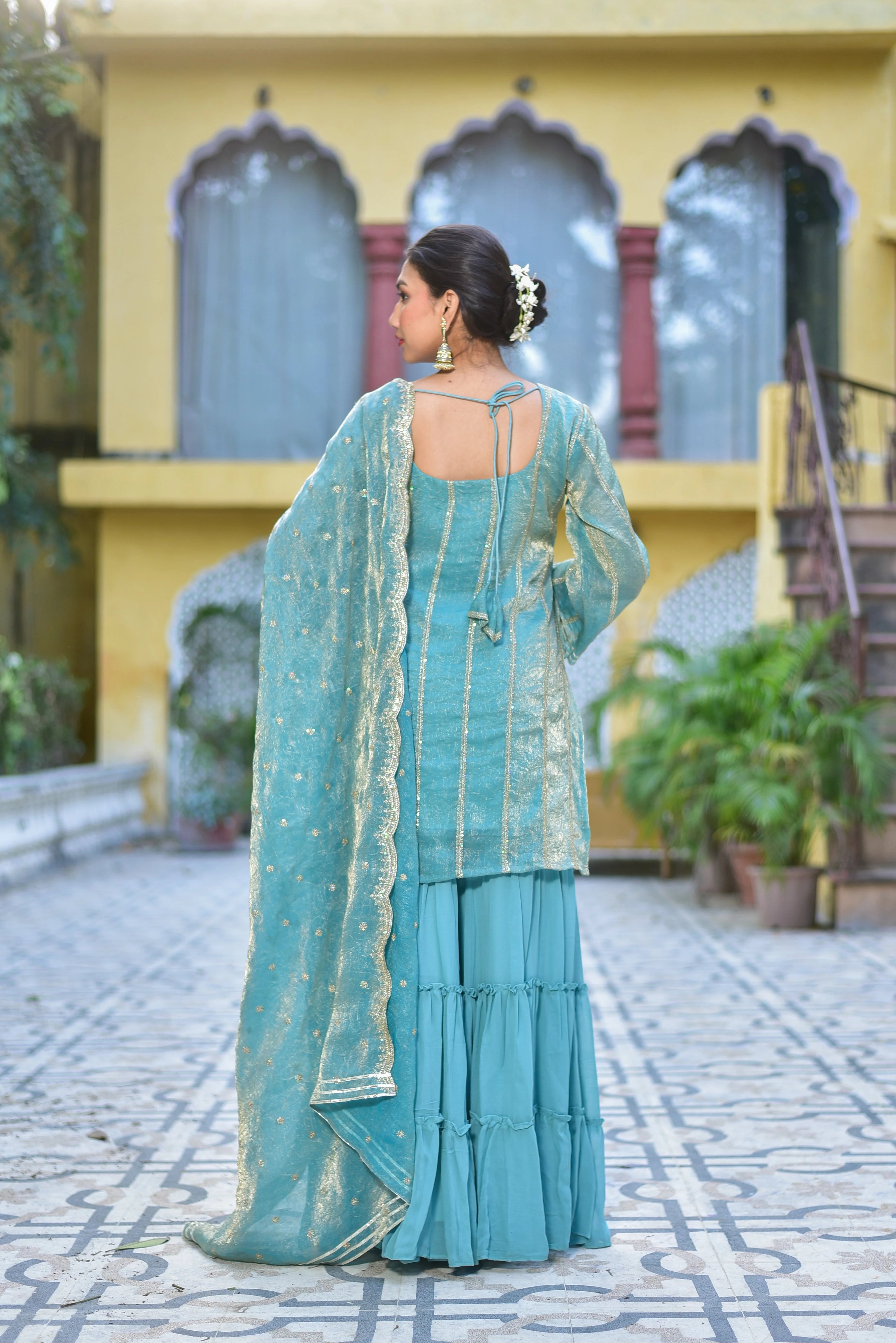 The Sea Green Kurta Sharara Set is a stunning ensemble that exudes elegance and sophistication. The sea green color of the outfit is reminiscent of the calmness of the ocean, evoking feelings of serenity and tranquility. The intricate gold embroidery on the kurta adds a touch of luxury and opulence, making it perfect for special occasions such as weddings, festivals, or formal events.
The kurta itself is a masterpiece of craftsmanship, with its delicate and flowing design that drapes elegantly on the body.