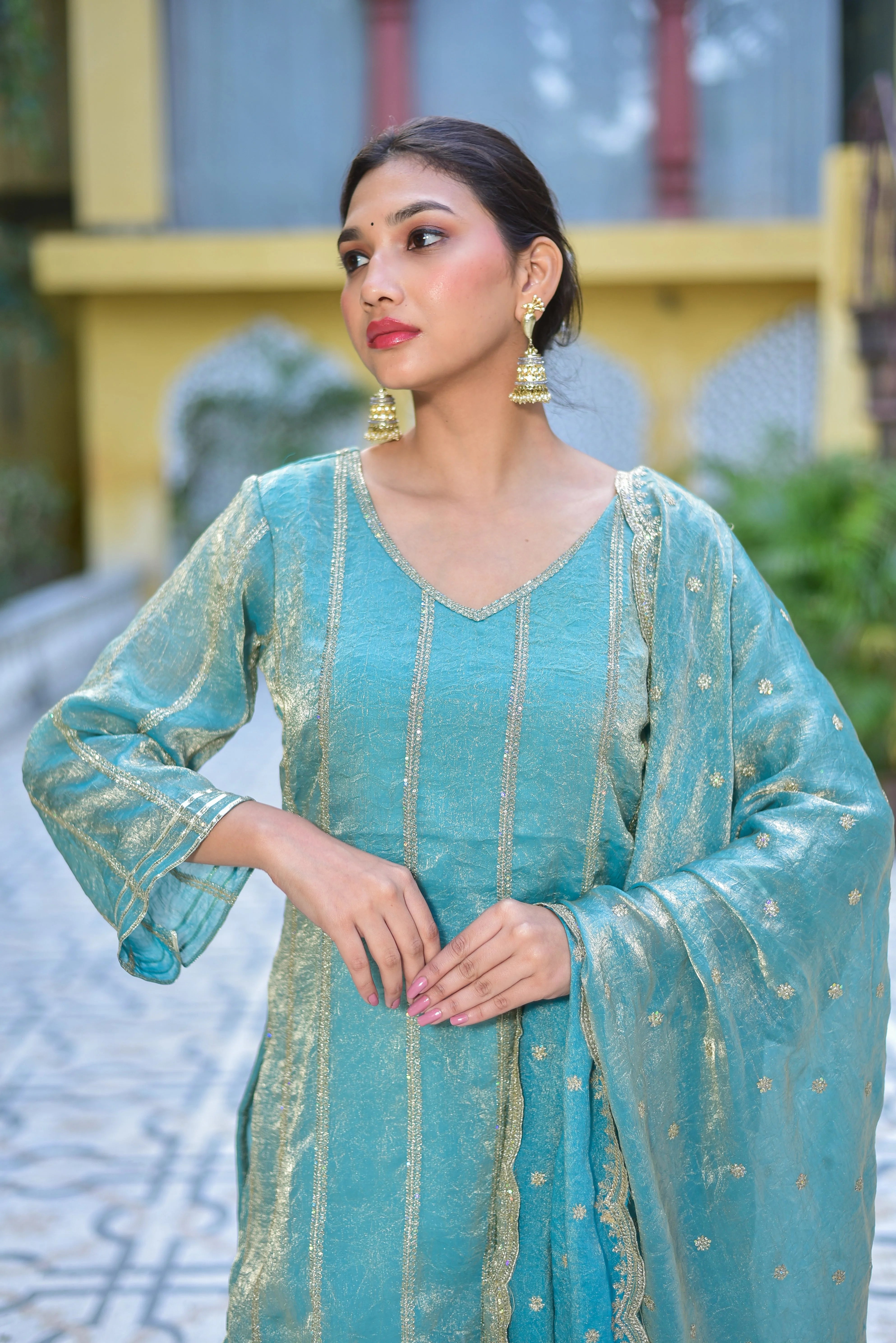 The Sea Green Kurta Sharara Set is a stunning ensemble that exudes elegance and sophistication. The intricate Sea Green color and luxurious fabric create a regal look, perfect for special occasions. The elegant design and comfortable fit make it an ideal choice for festive gatherings and celebrations. With its timeless charm and artisanal craftsmanship, this set is sure to make a statement.