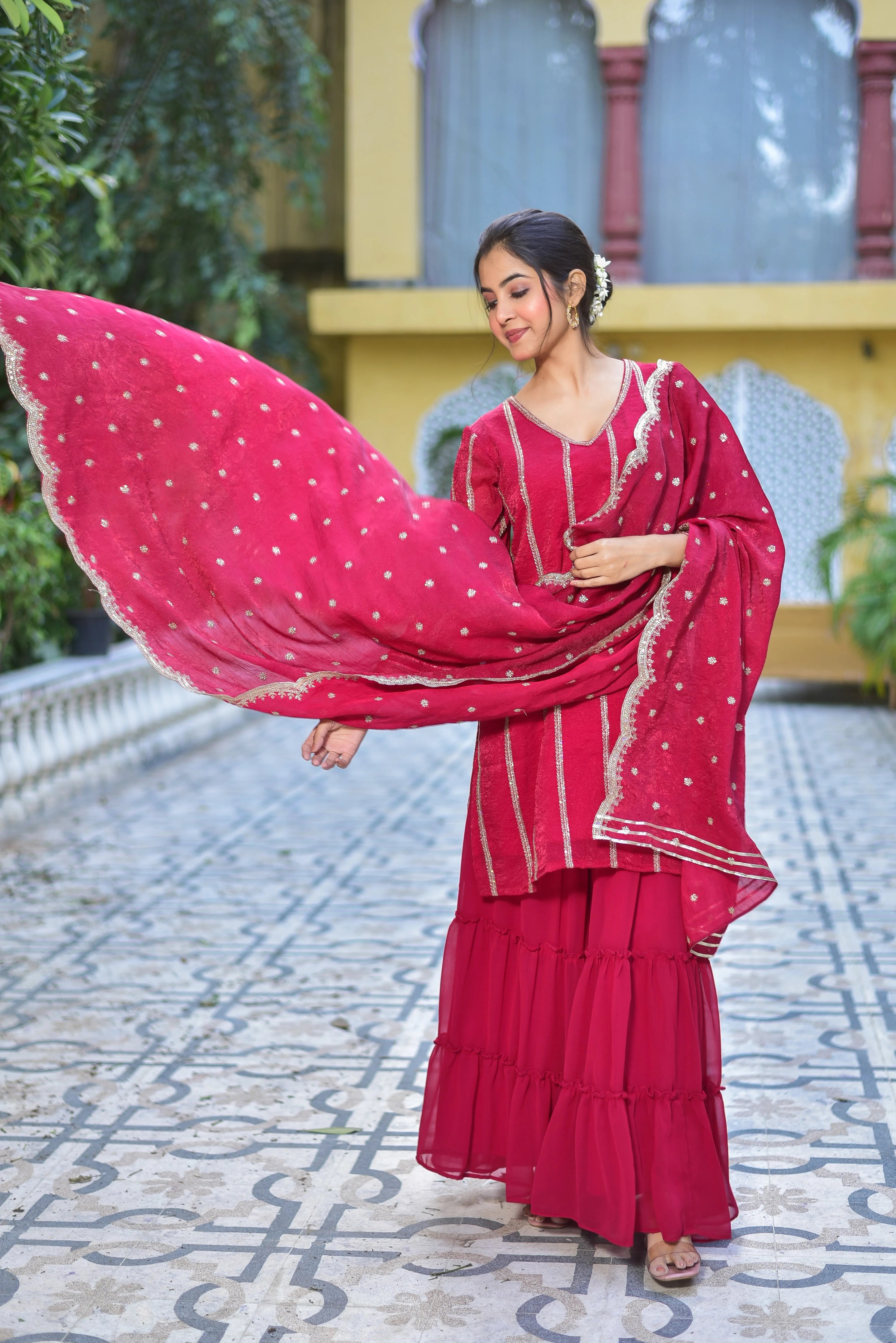 The Magenta Heavy Sharara Set is a stunning ensemble that exudes elegance and sophistication. This exquisite piece features a heavy, intricately designed magenta-colored fabric that is both luxurious and eye-catching. The sharara style of the pants adds a touch of modernity to the traditional attire, making it perfect for contemporary women who want to make a statement at any occasion.
The set is completed with a matching magenta dupatta, which adds a pop of color and texture to the overall look.