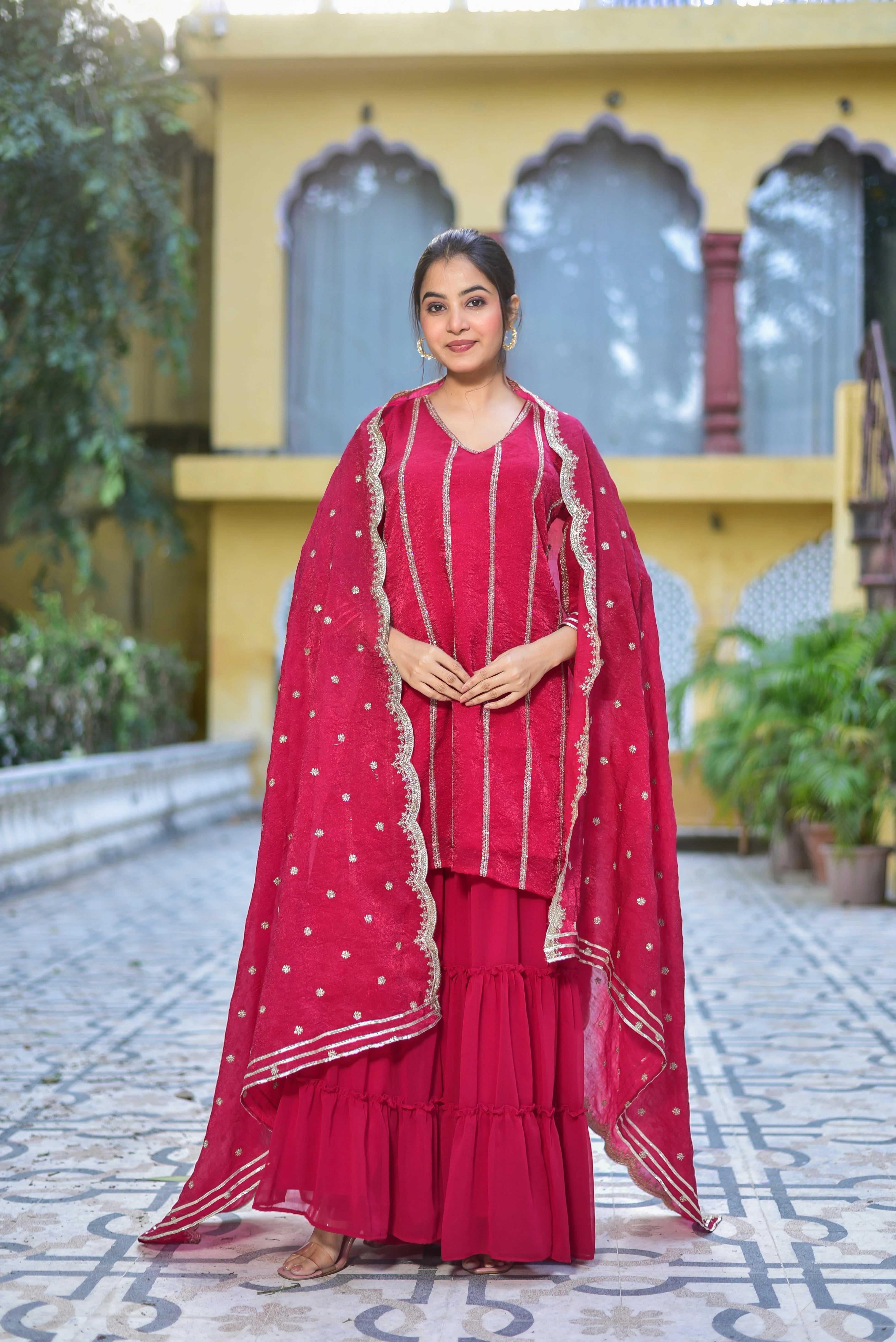 The Magenta Heavy Sharara Set is a stunning ensemble that exudes elegance and sophistication. The rich magenta hue of the fabric is complemented by intricate embroidery, adding a touch of luxury to the overall design. The heavy sharara pants are perfectly complemented by the matching kurta, creating a cohesive and stylish look that is perfect for formal occasions.
This ensemble is crafted from high-quality fabric, ensuring comfort and durability.
