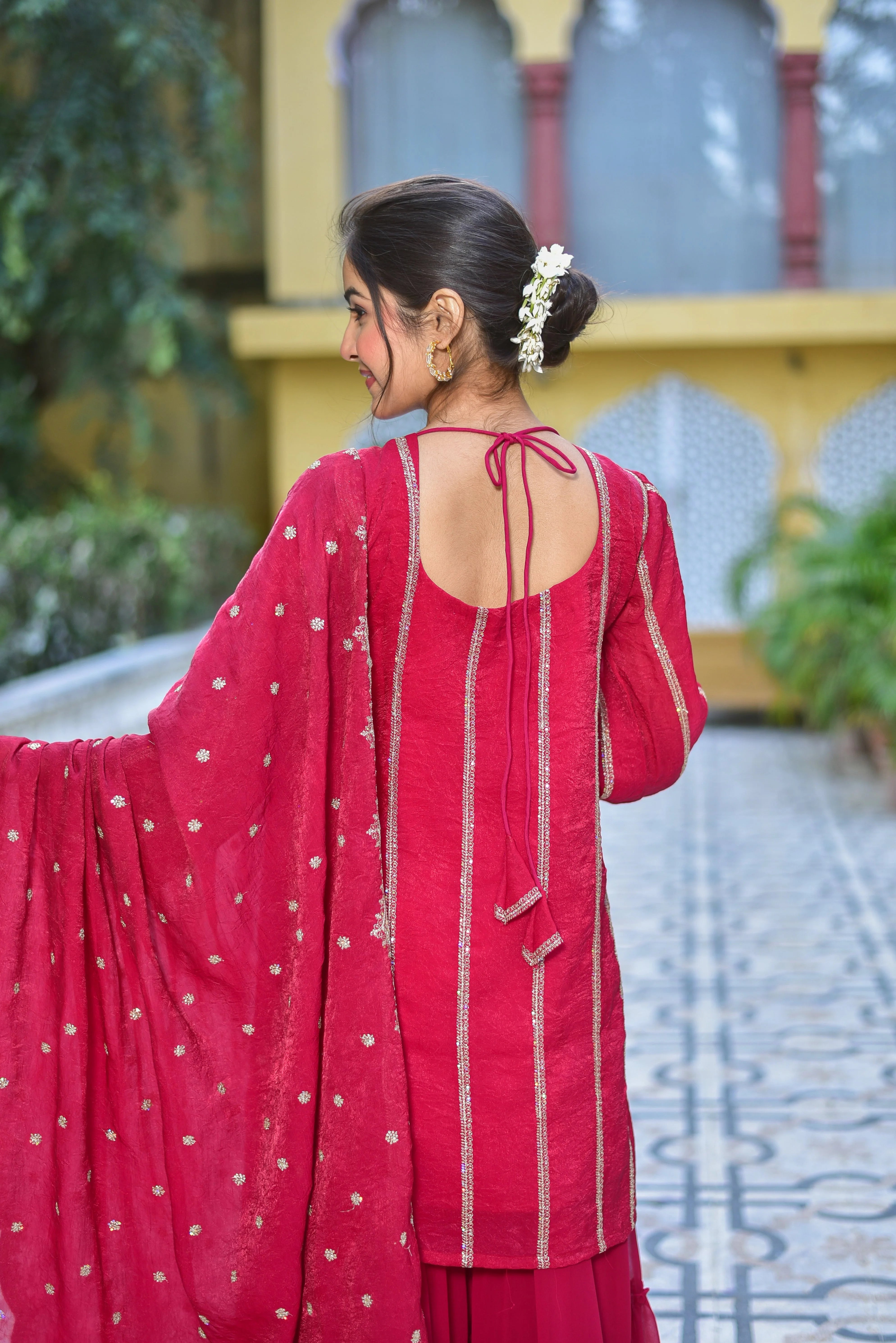 The Magenta Heavy Sharara Set is a stunning ensemble that exudes elegance and sophistication. Crafted from luxurious fabric, this set features intricate embroidery and a flowing silhouette, making it perfect for formal occasions and special events. The rich magenta hue adds a touch of drama and glamour, while the heavy fabric ensures a comfortable and flattering fit. Whether you're attending a wedding, festival, or simply want to make a statement, this set is sure to impress.