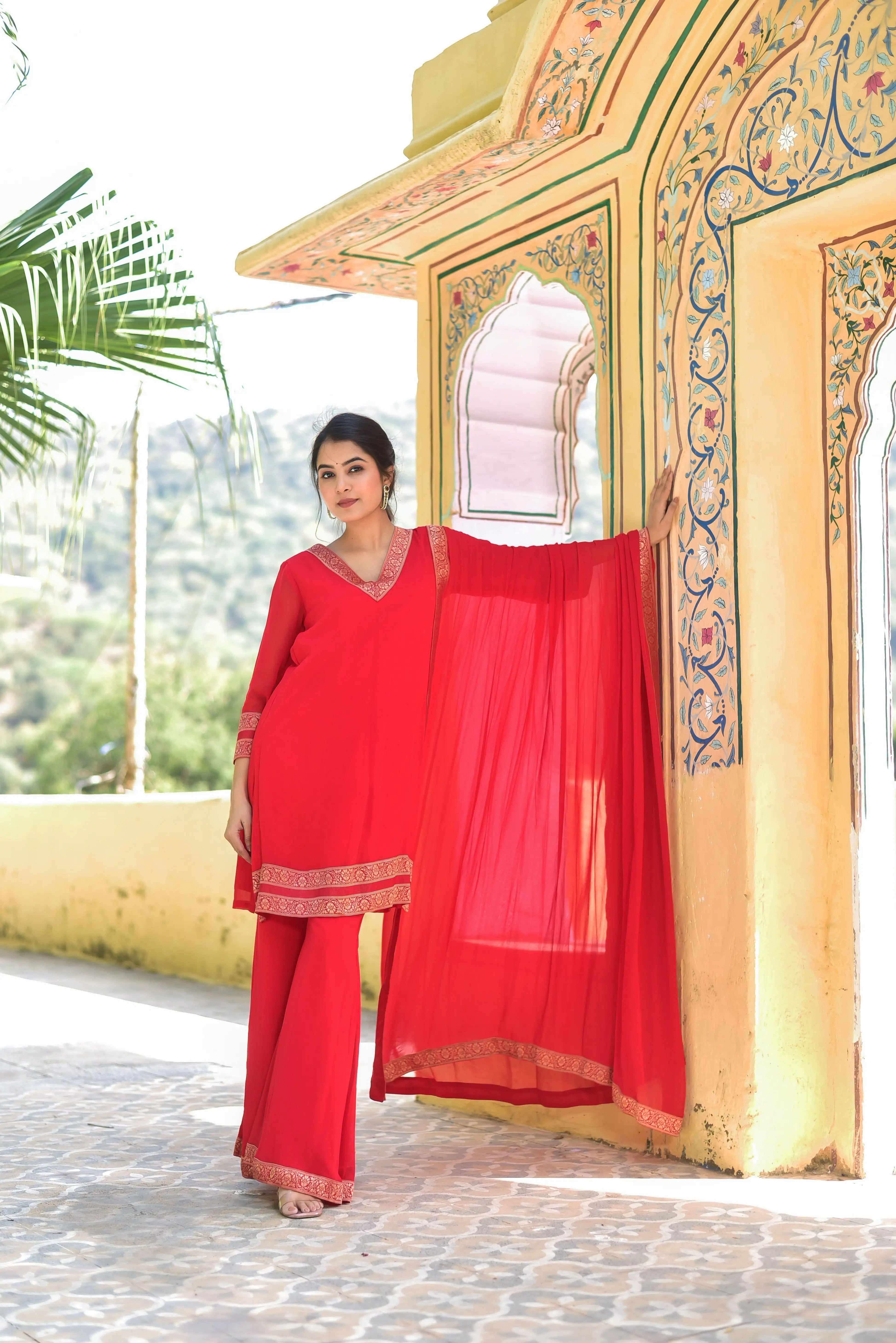 The Classic Red Brocade Kurta Set is a masterpiece of traditional craftsmanship, exuding elegance and sophistication. The vibrant red hue of the kurta is complemented by intricate brocade detailing, adding a touch of royal grandeur to the overall design. The set features a classic kurta with a V-neckline and three-quarter sleeves, paired with matching pants and a dupatta, creating a stunning and timeless ensemble perfect for special occasions.