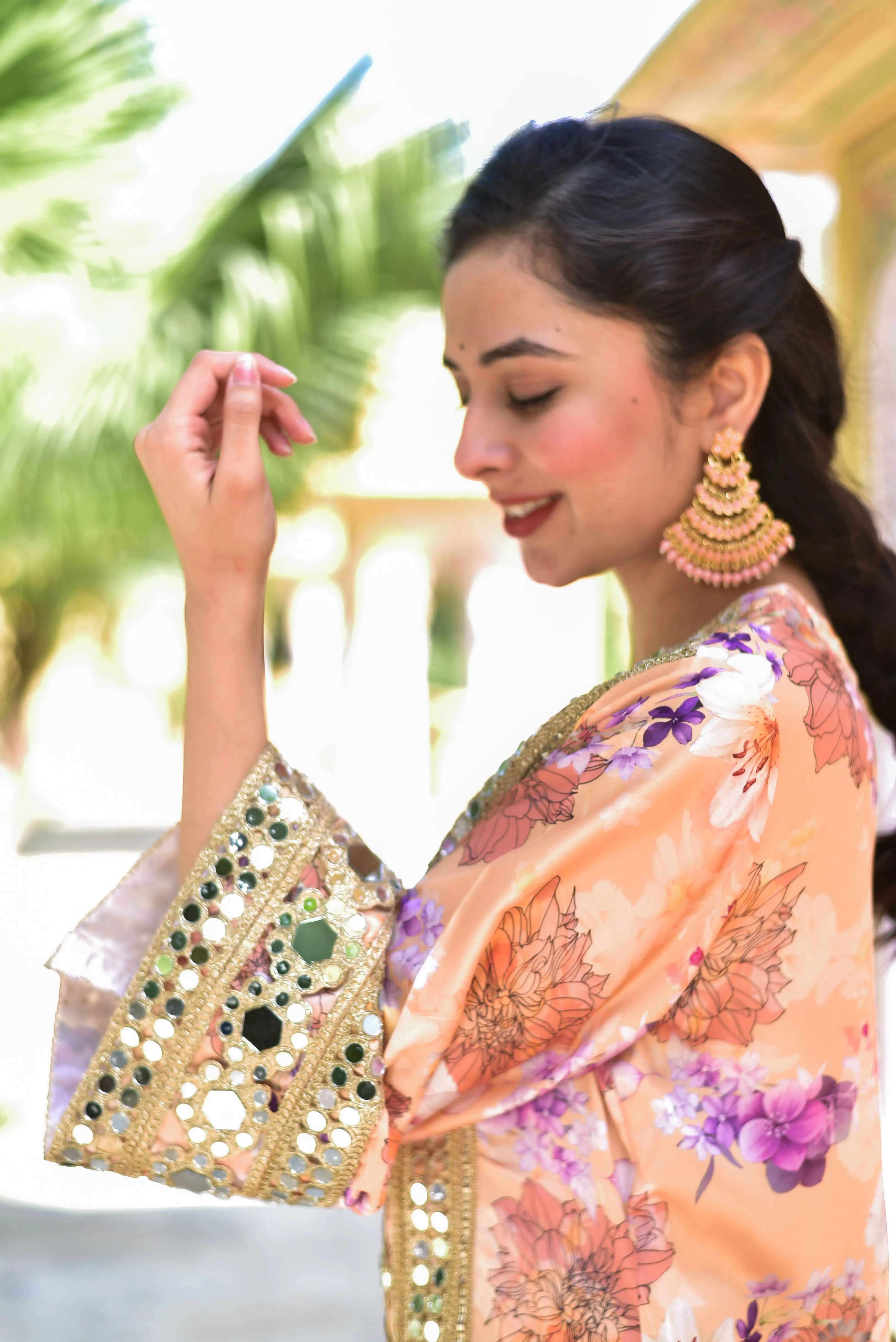 This satin kurta boasts a vibrant digital floral print, complemented by intricate mirror work that adds a touch of elegance to the luxurious fabric. The shimmering accents catch the light with every step, making this piece a stunning addition to any wardrobe. Crafted with high-quality materials, this kurta is sure to turn heads and make a statement. Elevate your style with this exquisite piece, perfect for formal occasions or everyday wear.