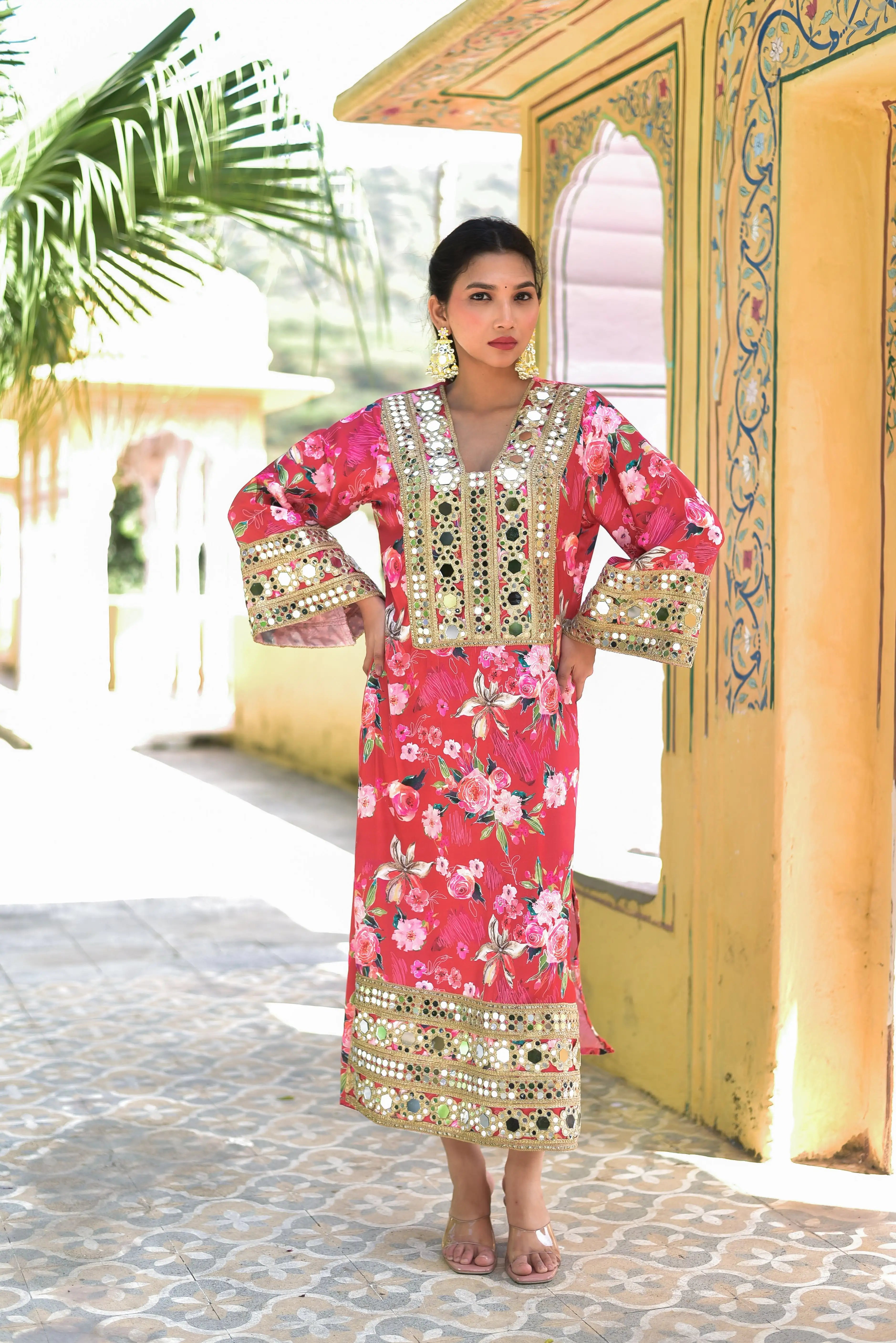 This enchanting floral rosy satin afghani dress is a masterpiece of digital artistry and mirror embellishments. The vibrant digital floral prints on luxurious fabric create a stunning visual effect, while the shimmering mirror work captures light with every step. The elegant design, trendy style, and high-quality materials make it a must-have for those seeking the highest sales. This product is preferred for its unique blend of traditional and modern elements, making it a standout piece in any wardrobe.