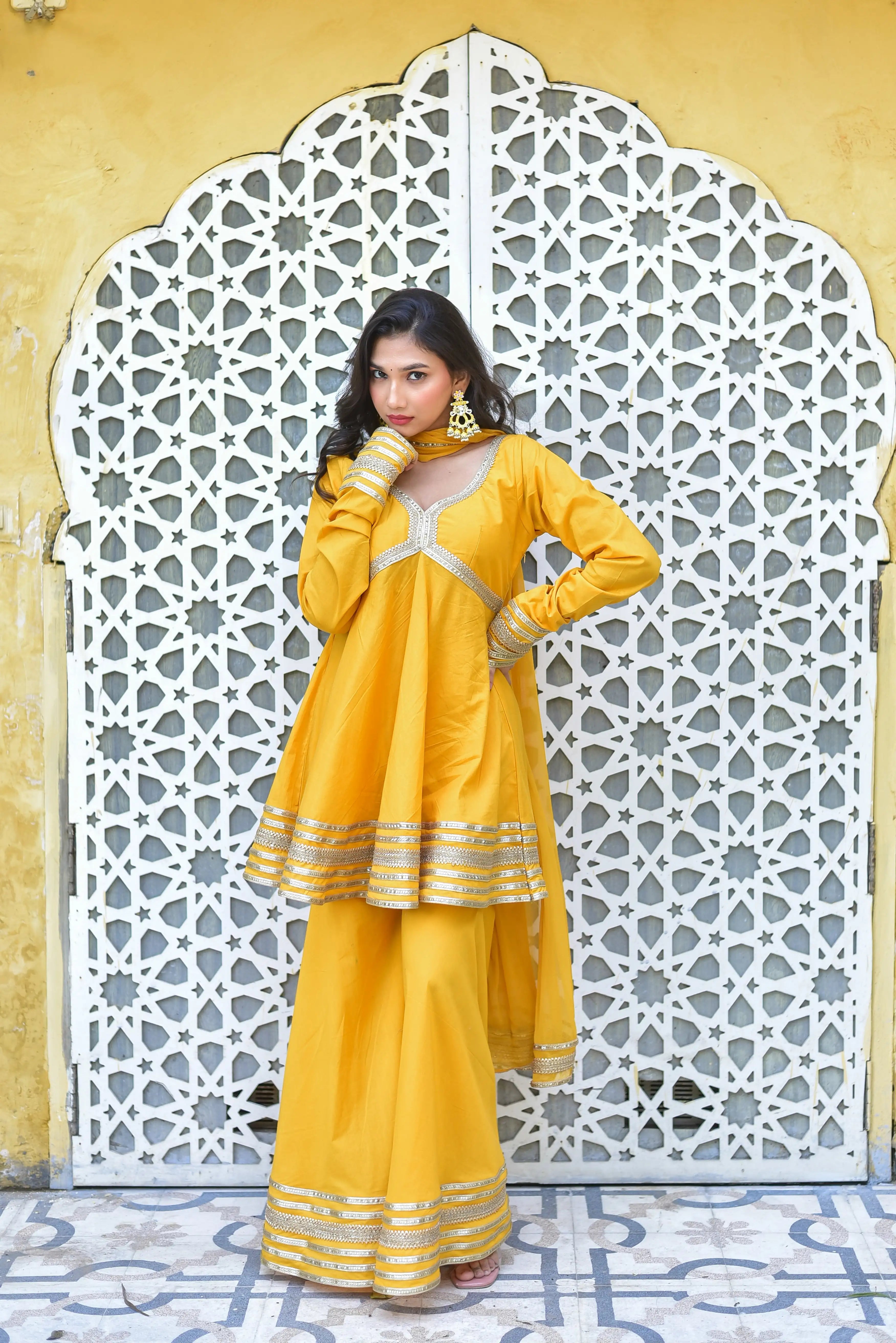 The peet amber sharara suit set is a stunning and elegant ensemble that exudes sophistication and style. The rich mustard-yellow hue of the outfit is a timeless choice for festive occasions, radiating joy, prosperity, and vibrant energy. The intricate design and craftsmanship of the suit are evident in the delicate patterns and details that adorn the fabric, making it a true masterpiece of fashion.
