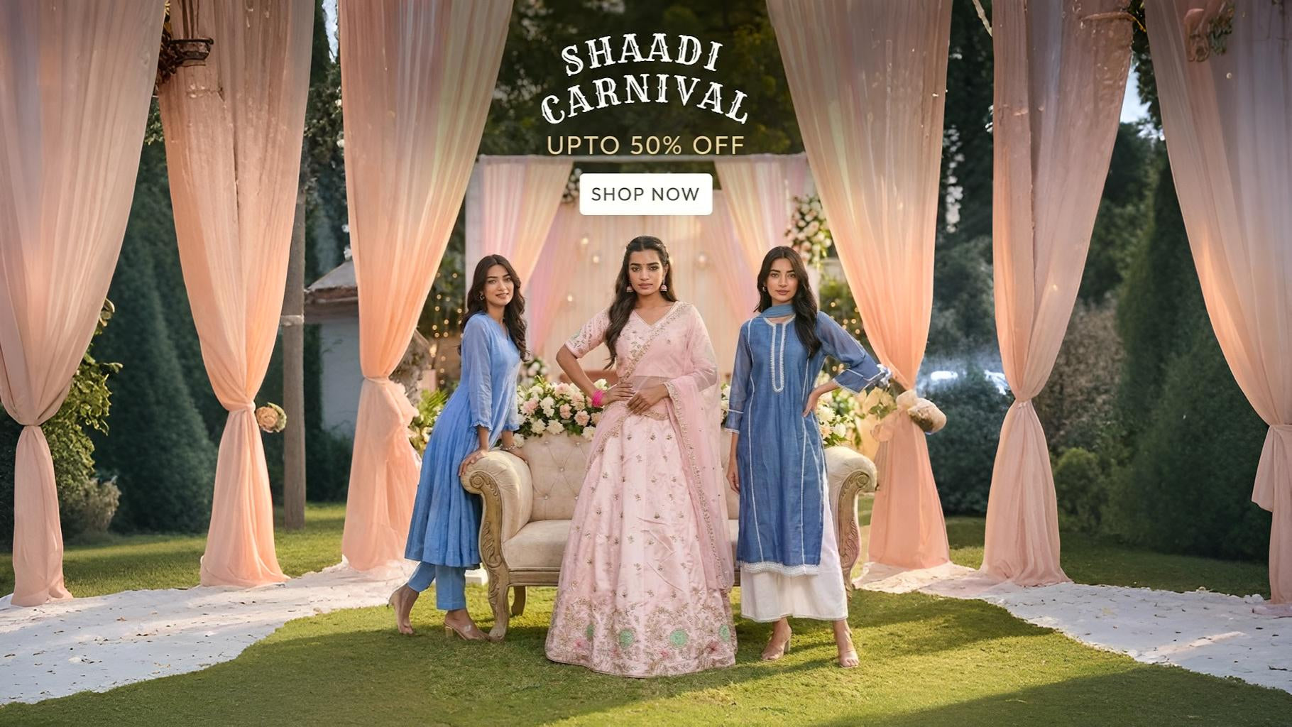 Three women in traditional attire standing under a 'Shaadi Carnival' promotional banner with a garden setting.