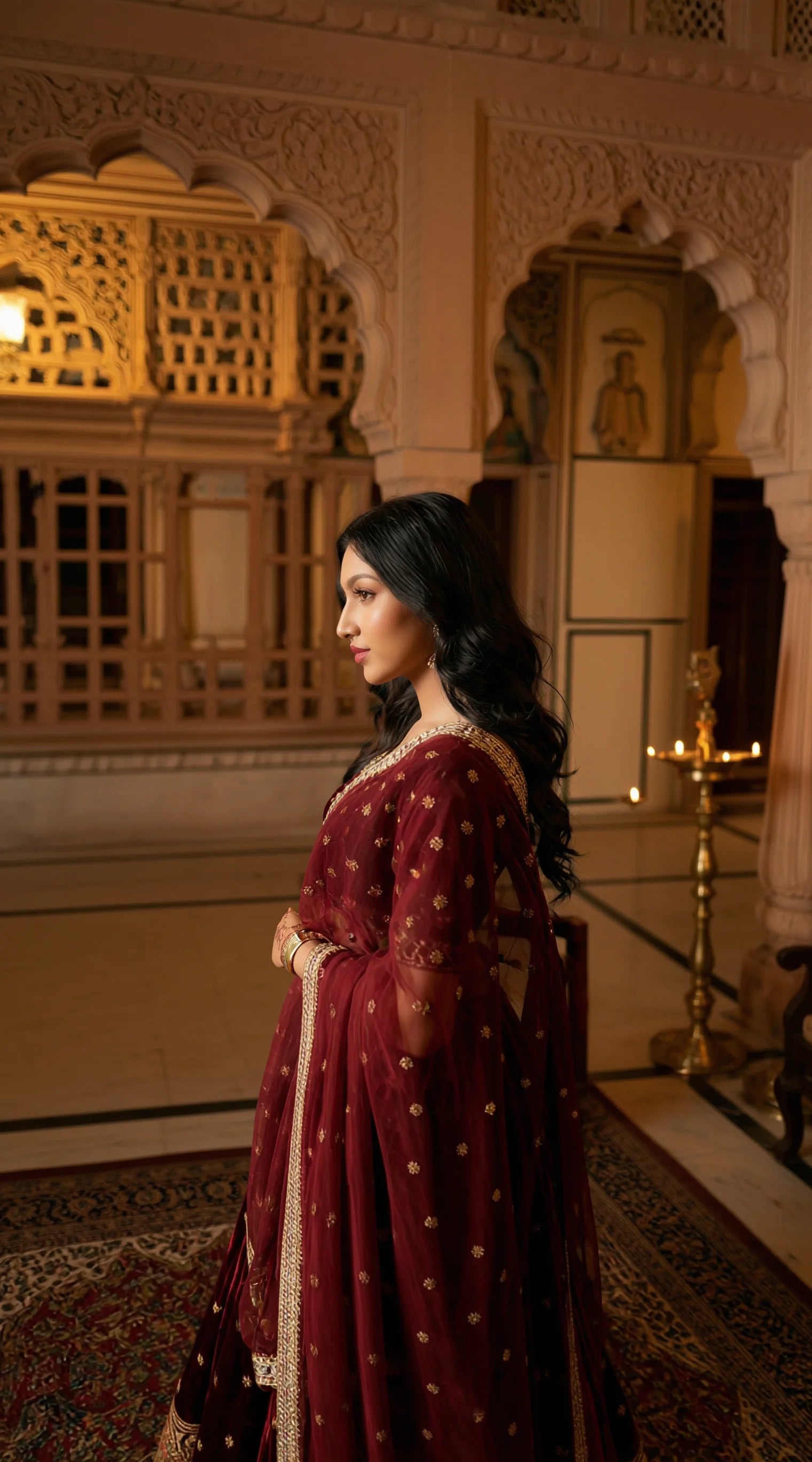 Ethnic Velvet Lehenga Set by Saroj Jain, maroon base with intricate zari-style gold detailing.
