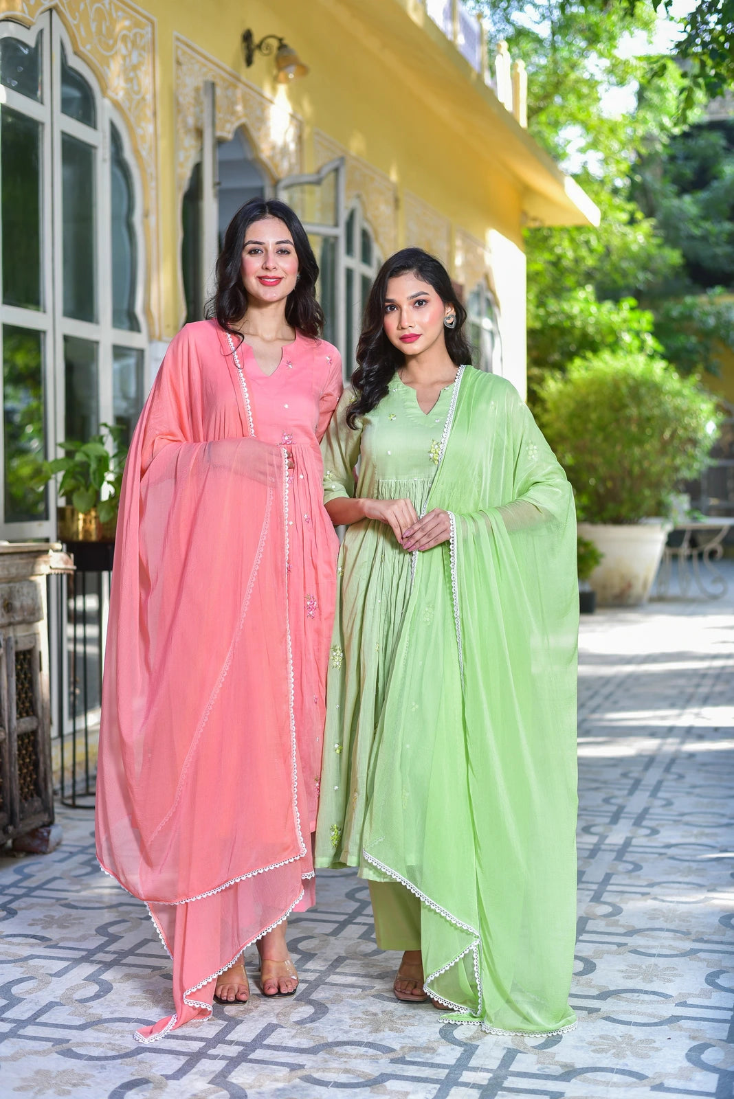 The Peach Petal Kurta Set - A stunning 3-piece ensemble that combines elegance with comfort. This beautiful set features a gracefully flared kurta in a lovely peach hue, crafted from premium pure cotton fabric for all-day comfort. The kurta is adorned with delicate embroidery and intricate lace details, adding a touch of sophistication to your wardrobe. The matching palazzo pants and dupatta complete the look, making it perfect for any occasion.