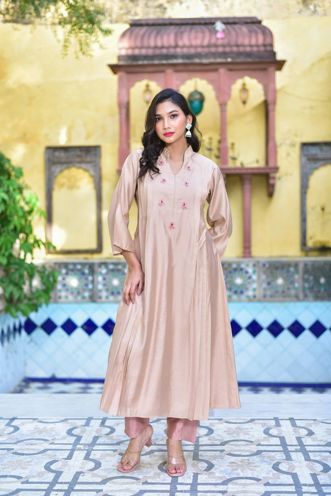 The Creamy Kaju Katli Pleated Kurta Set is a stunning 2-piece ensemble that embodies traditional elegance with a modern twist. This luxurious outfit features a creamy beige color, made from high-quality fabric that drapes elegantly on the body. The pleated design adds a touch of sophistication, while the intricate embroidery on the kurta exudes a sense of refinement.
This elegant set is perfect for any special occasion, from weddings to formal events.