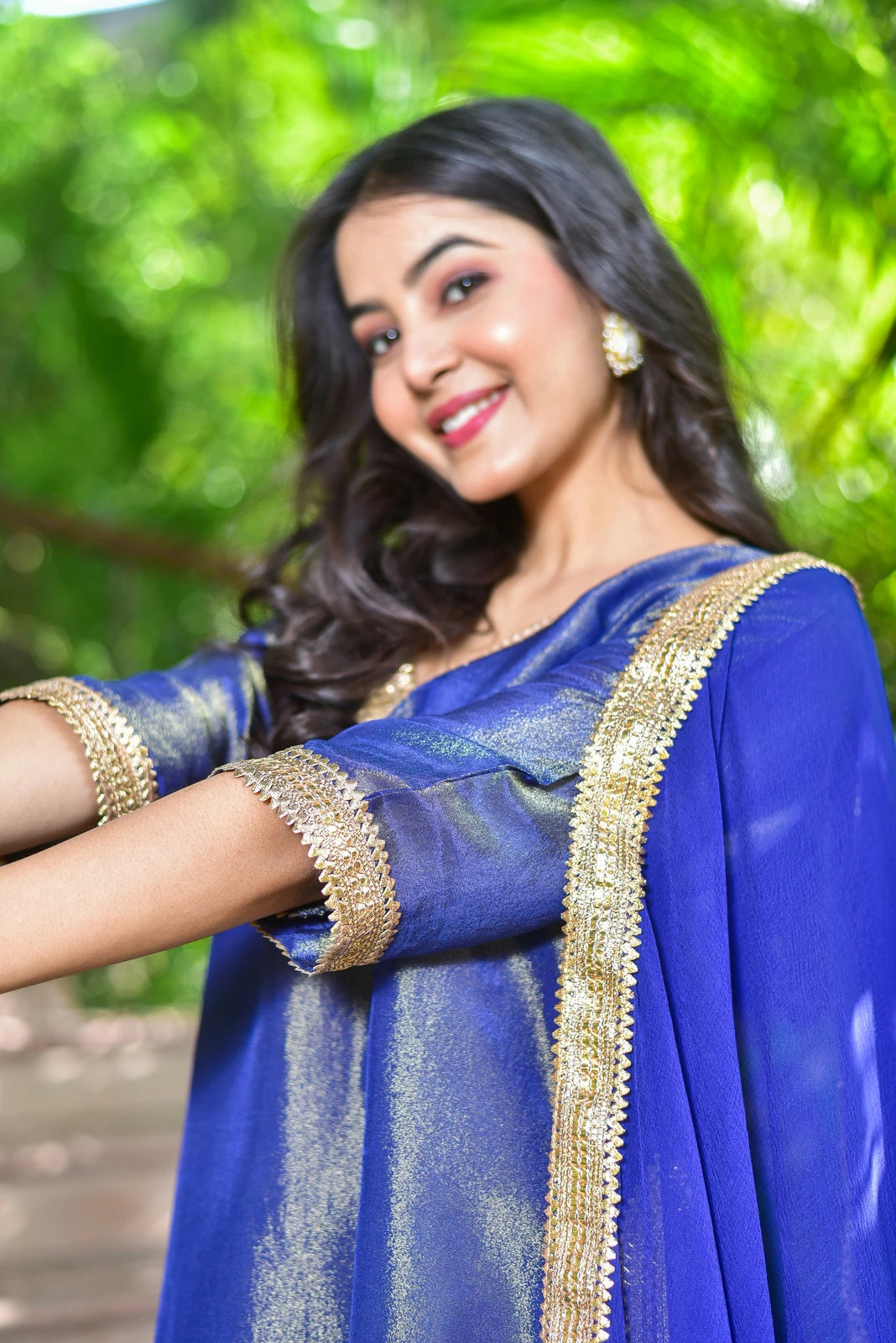 The Ocean Pearl Kurta Set is a stunning 3-piece ensemble that embodies the elegance and beauty of the ocean. Crafted from rich zari silk fabric, this exquisite set features intricate gold lace work and a captivating design that's perfect for festive celebrations and special occasions. With its luxurious fabric and elegant style, this kurta set is sure to make a statement and leave a lasting impression.