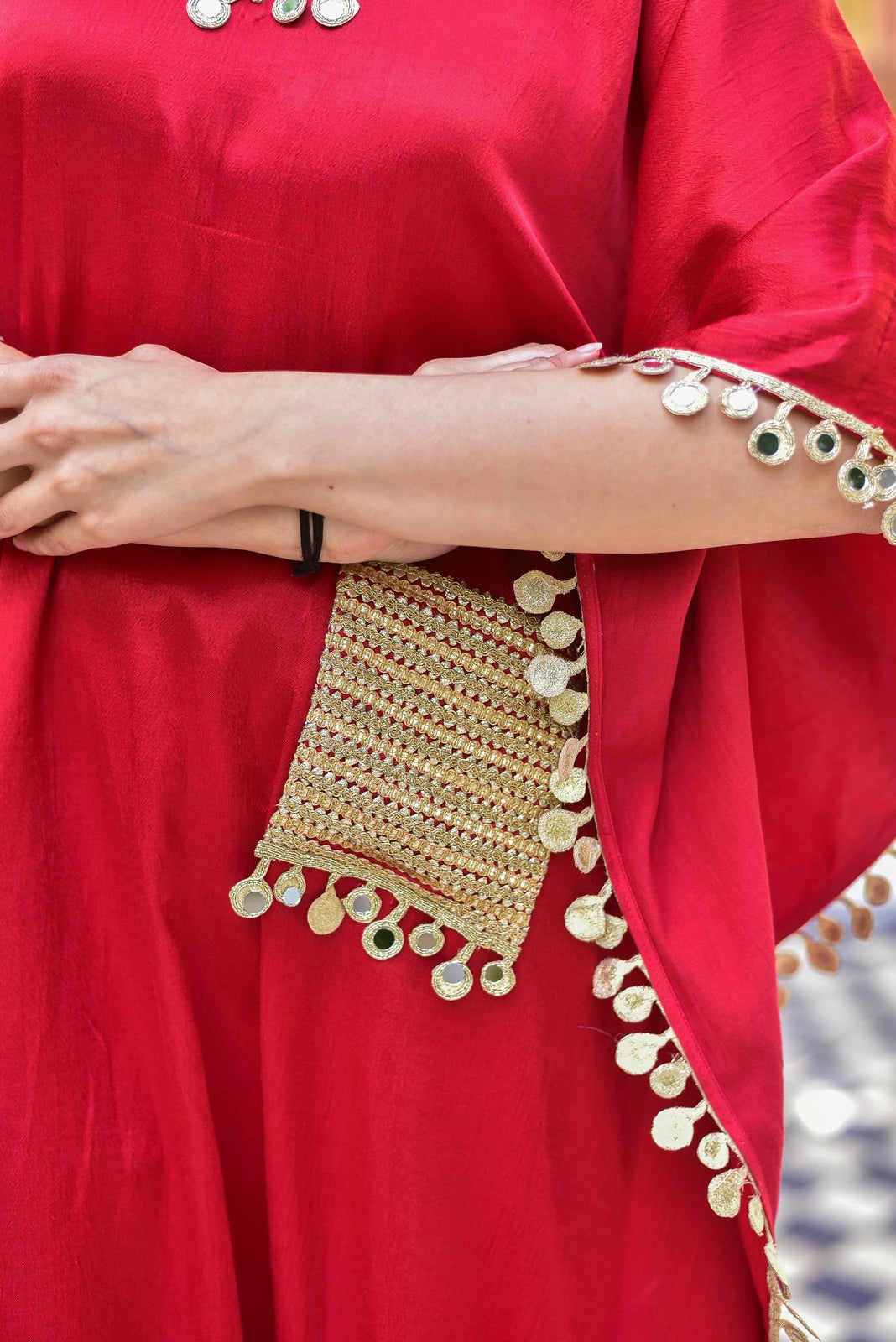 Elegant and Stylish Kaftan Set
This stunning kaftan set is crafted from luxurious Gazzi Satin fabric, exuding elegance and sophistication. The rich, deep red color is complemented by intricate mirror work detailing that adds a touch of glamour to the overall design.
Key Features:
Gazzi Satin Fabric: The fabric used for this kaftan set is of the highest quality, providing a smooth and luxurious feel against the skin.