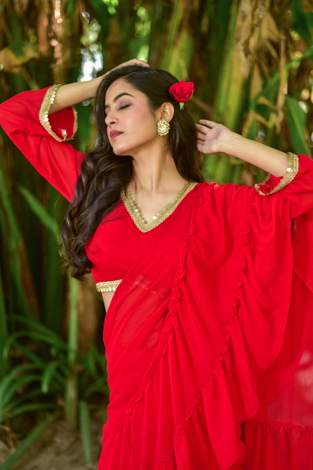 The Regal Red Georgette Sharara Saree Set is a stunning fusion of traditional grace and contemporary design, perfect for weddings, festive celebrations, and special occasions. This exquisite ensemble features a vibrant red georgette fabric, complemented by a matching blouse and a flowing sharara, creating a captivating and elegant look. With its intricate details and high-quality craftsmanship, this set is sure to make a statement and leave a lasting impression.