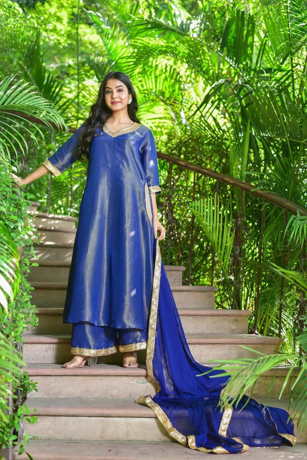The Ocean Pearl Kurta Set is a luxurious 3-piece ensemble that exudes timeless elegance, capturing the depth and beauty of the ocean. Crafted from rich zari silk fabric, this stunning set features exquisite gold lace work, perfect for festive celebrations and special occasions. The Ocean Pearl Kurta Set is a luxurious 3-piece ensemble that exudes timeless elegance, capturing the depth and beauty of the ocean.