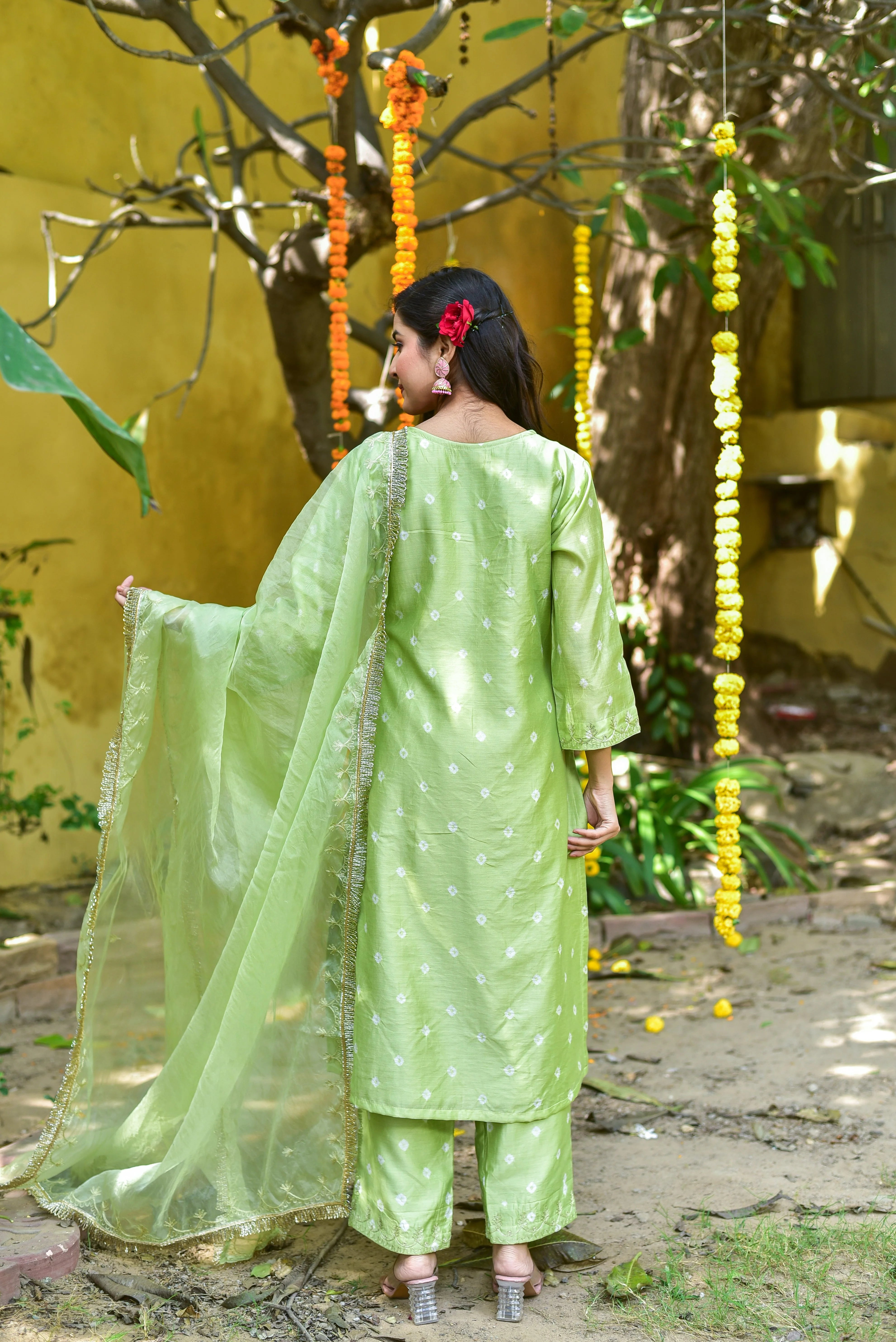 The Green Bandhej A-Line Kurta Set is a stunning piece of traditional Indian attire that embodies the essence of elegance and sophistication. This exquisite ensemble showcases a beautiful mint-green hue, adorned with intricate bandhej tie-dye patterns that add a touch of cultural charm to any occasion.

The kurta, crafted from luxurious fabric, features an A-line silhouette that flatters the figure, while the three-quarter sleeves provide a comfortable and stylish fit.