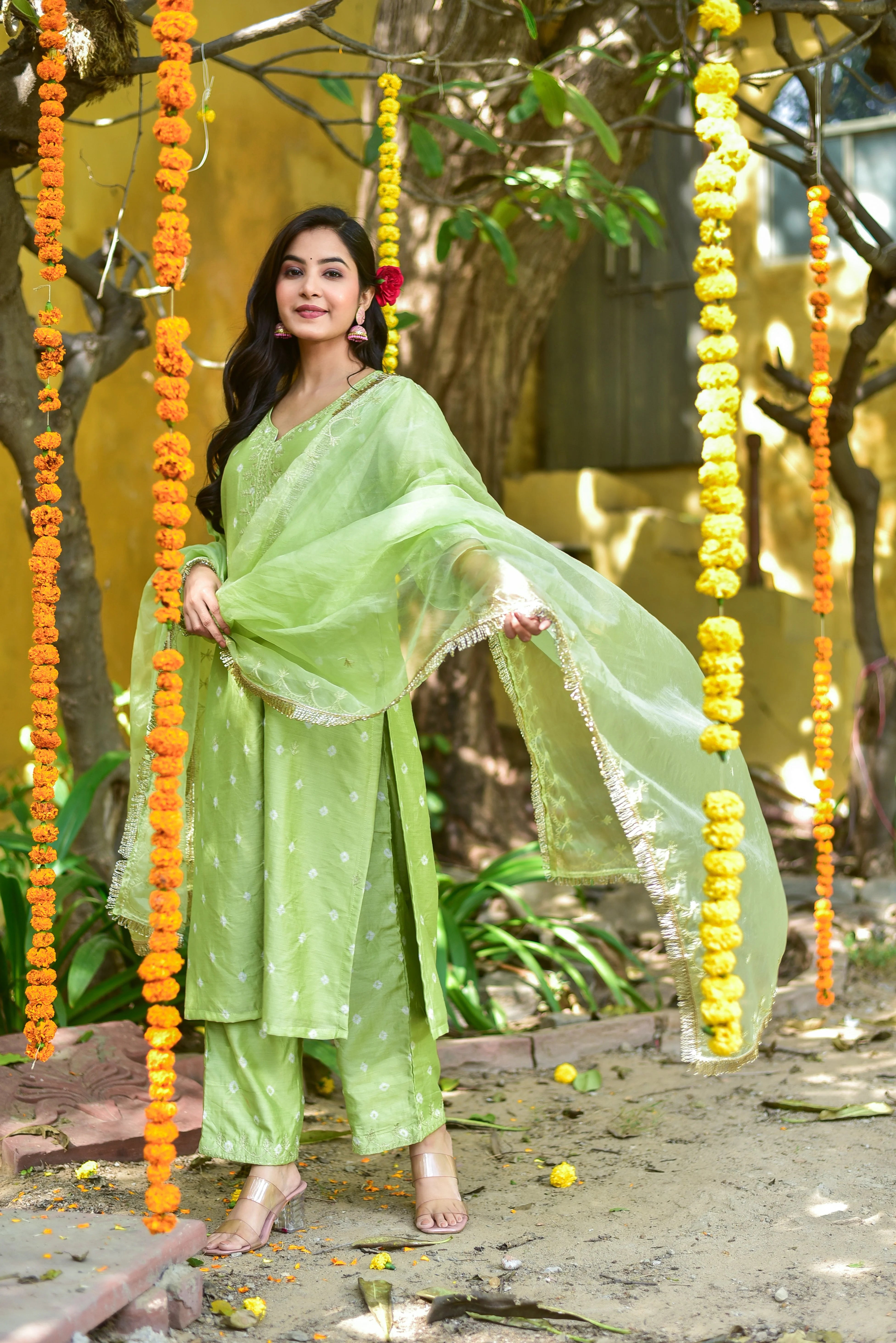 The Green Bandhej A-Line Kurta Set is a stunning ensemble that embodies the essence of traditional Indian fashion with a modern twist. This exquisite piece of clothing is a masterpiece of craftsmanship, featuring intricate bandhej tie-dye patterns in a soothing mint-green hue that exudes freshness and elegance.

The A-line silhouette of the kurta creates a flattering and feminine shape, while the straight-cut pants provide a comfortable and stylish alternative to traditional palazzos or churidars.
