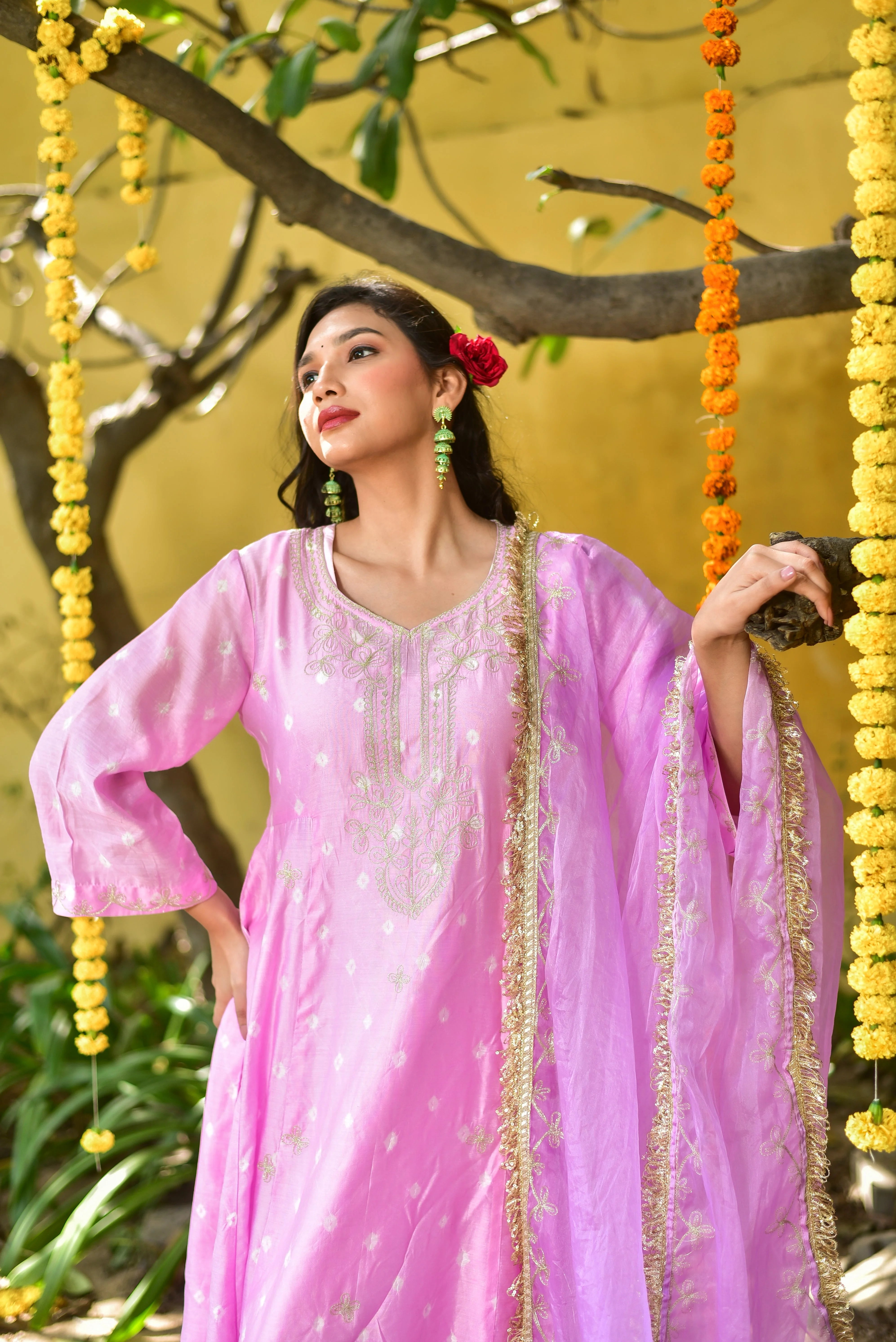 The Baby Pink Bandhej Kurta Set is a stunning example of traditional Indian craftsmanship, featuring a delicate baby pink hue and intricate tie-dye artistry. Crafted from premium fabrics, this set exudes elegance and sophistication, making it a perfect choice for any occasion. The kurta's soft, flowing design and the matching bottom and dupatta create a harmonious ensemble that is both comfortable and stylish.