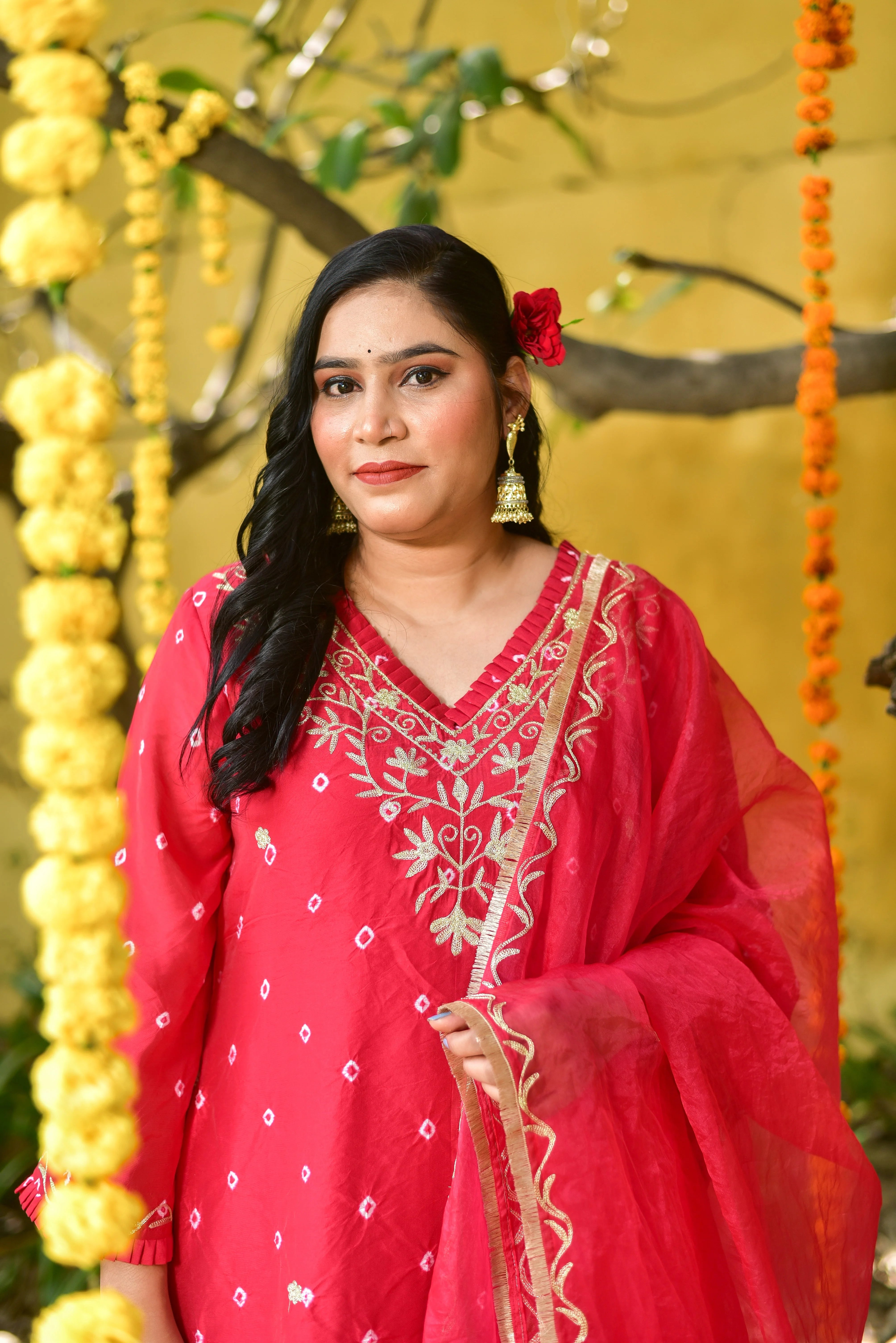 "Unveil the beauty of tradition with a modern twist in this stunning red Bandhej asymmetrical kurta set. Hand-crafted with intricate tie-dye artistry, this ensemble embodies the vibrant spirit of festive celebrations while offering sophisticated silhouette elegance. Elevate your style with this elegant, amazing, and trendy piece that's sure to drive sales and preferred choices.
