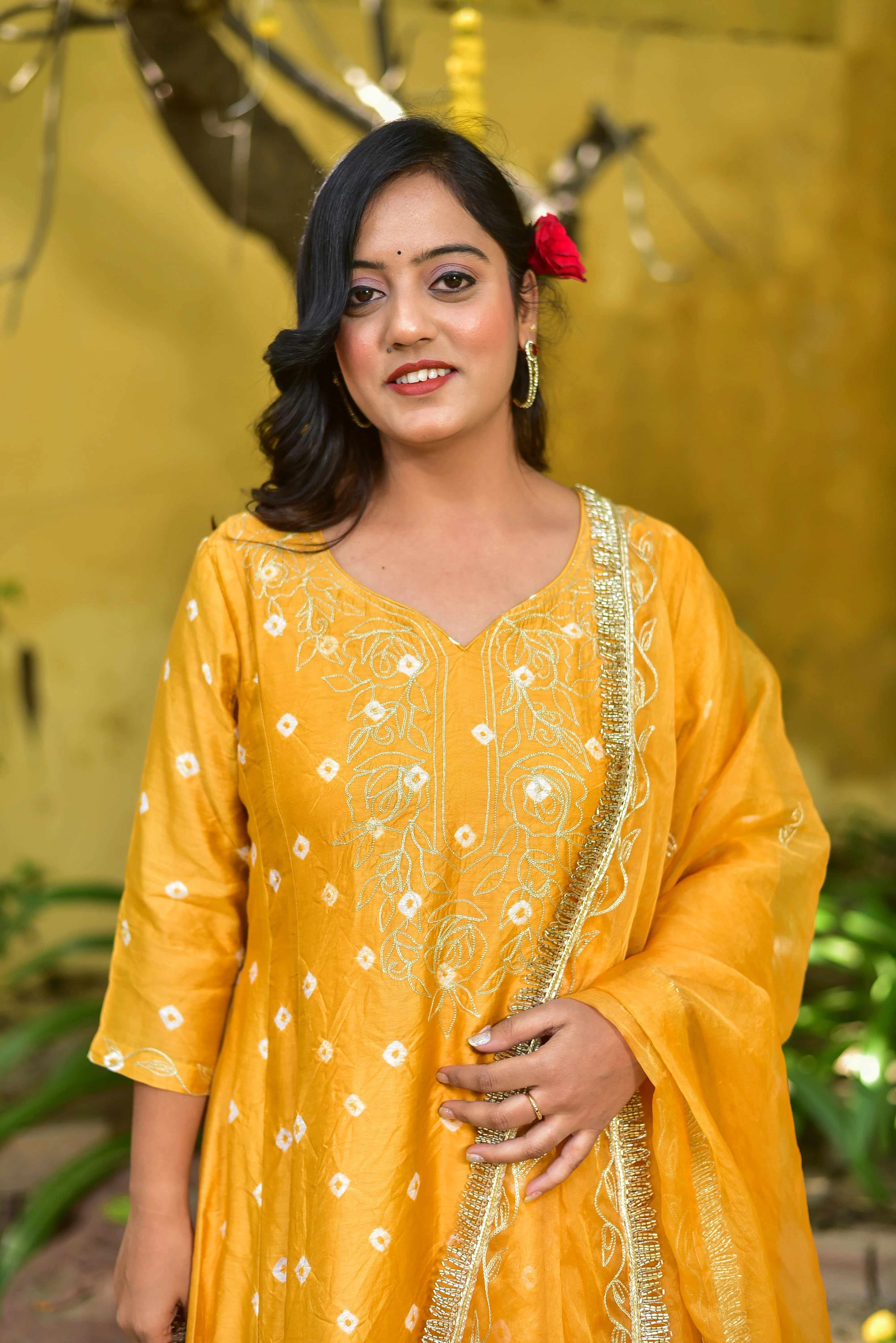The Mustard Yellow Bhandej Kurta Set is a stunning ensemble that exudes elegance and festive charm. The luminous mustard yellow hue, reminiscent of sunshine and joy, is a perfect choice for auspicious occasions. Crafted with intricate bandhani craftsmanship, this set features a kurta and pant combination that showcases the beauty of traditional Indian textiles.

The kurta boasts a classic V-neckline and three-quarter sleeves, providing a comfortable and stylish fit.
