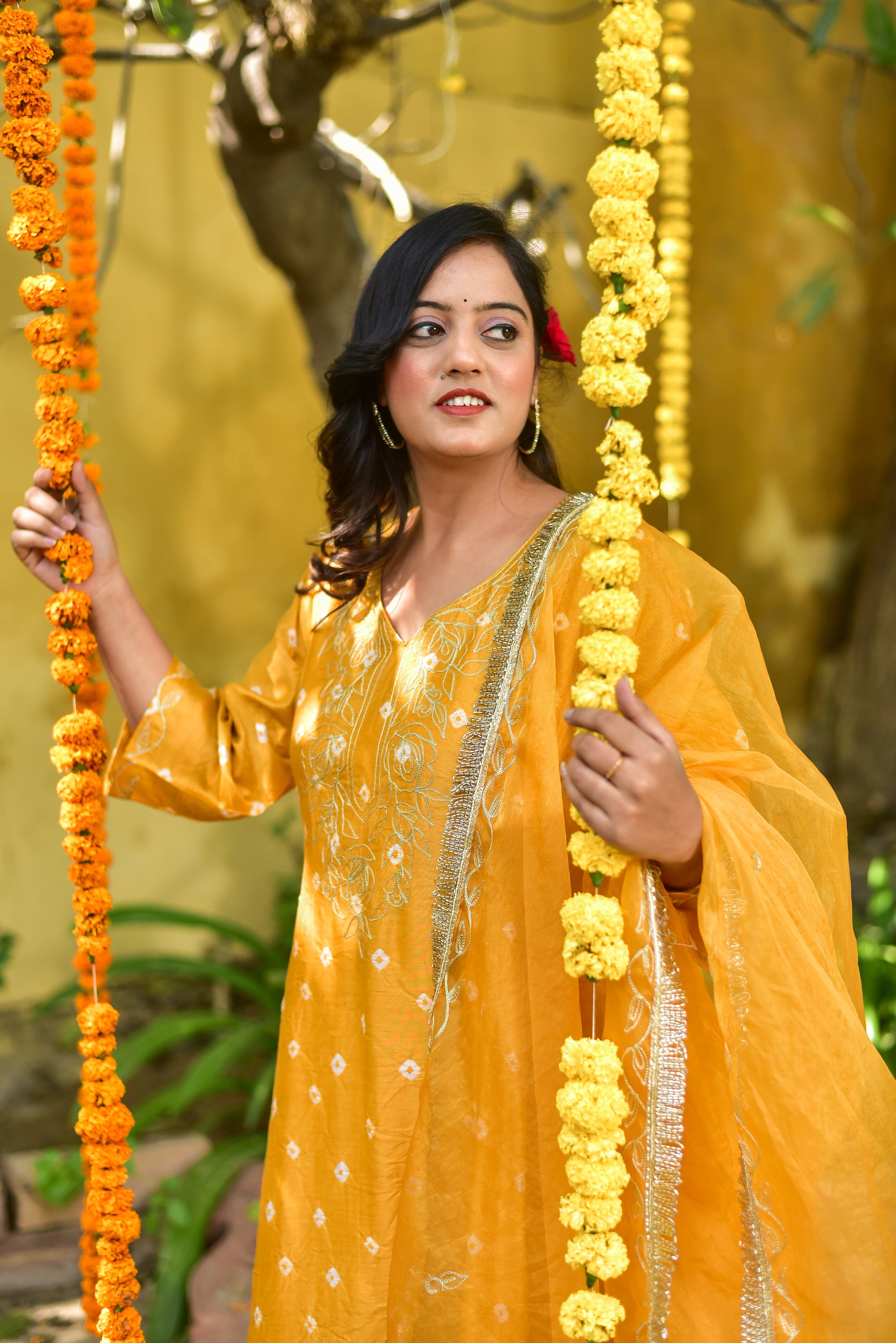 The Mustard Yellow Bhandej Kurta Set is a stunning ensemble that embodies the essence of traditional Indian craftsmanship and vibrant elegance. The luminous mustard yellow hue radiates warmth and festive charm, making it perfect for auspicious occasions and celebrations. The intricate bandhani work adds a touch of sophistication and cultural heritage to the outfit, while the elegant design ensures a comfortable and flattering fit.