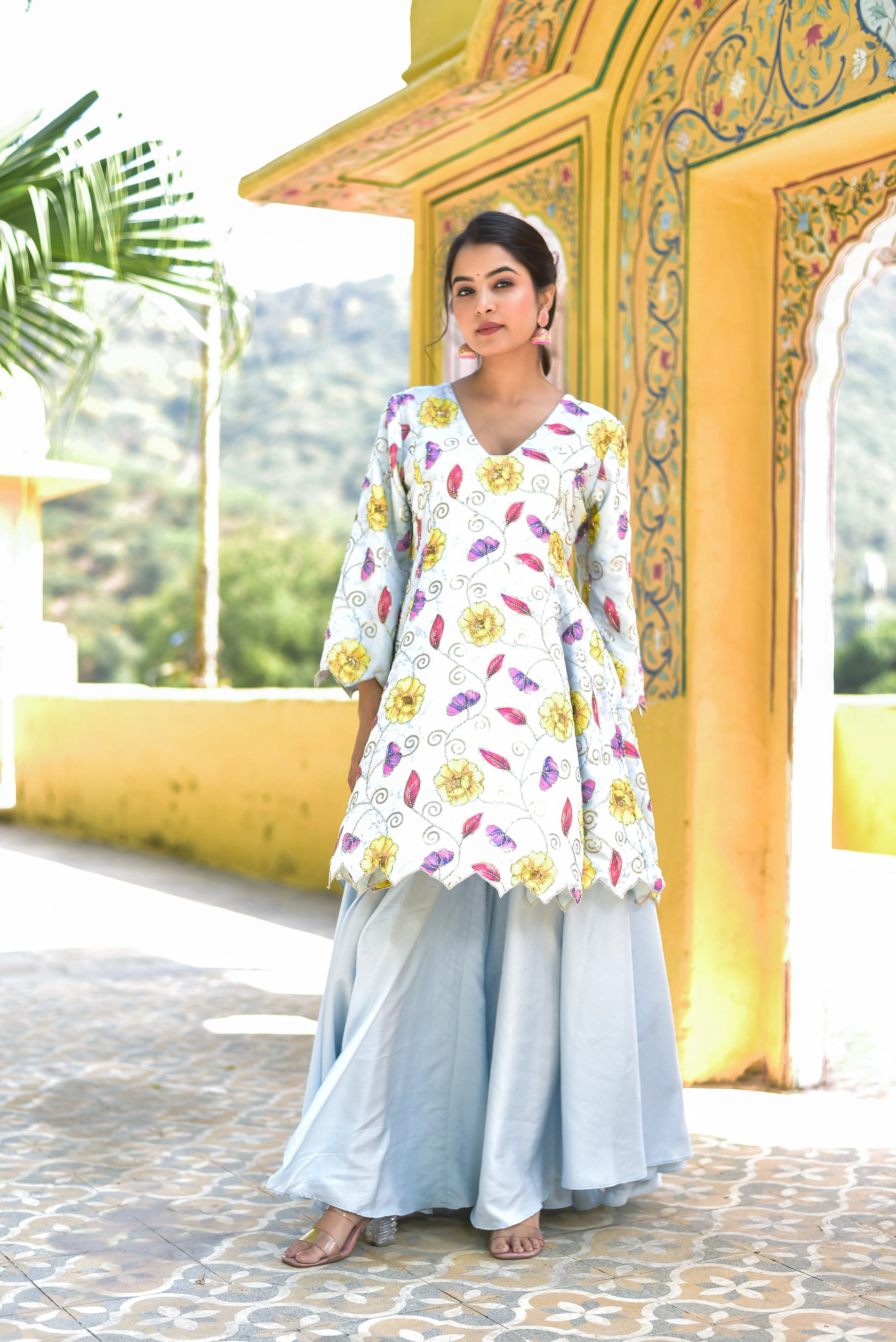 The Blue Morning Mist Floral Kurta Set is a breathtaking ensemble that captures the essence of a serene and vibrant morning garden. The soft blue and white hues of the kurta are adorned with intricate floral patterns, featuring a variety of blooms in shades of yellow, pink, and purple. The delicate embroidery adds a touch of elegance to the overall design.

This set is perfect for those who appreciate the beauty of nature and the artistry of traditional Indian fashion.