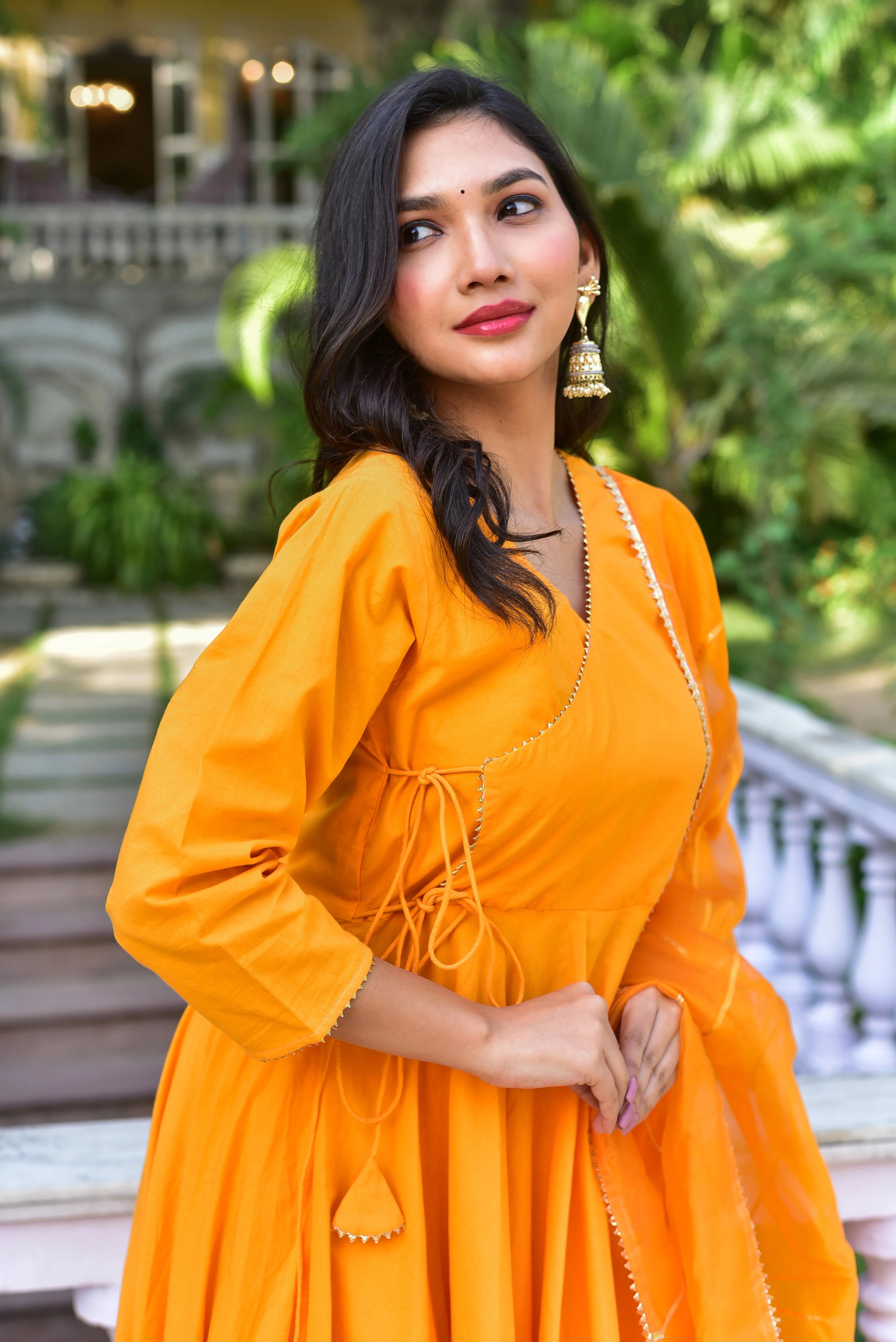 Radiant Haldi Yellow Angrakha Anarkali Set: A Masterpiece of Traditional Elegance

This stunning Haldi Yellow Angrakha Anarkali Set embodies the essence of traditional Indian craftsmanship, seamlessly blending heritage with contemporary style. The vibrant haldi yellow hue, reminiscent of the sun-kissed hues of Holi, exudes warmth and energy, perfect for the festive season.

Fabric and Craftsmanship

The set features luxurious fabrics, carefully selected for their comfort and durability.