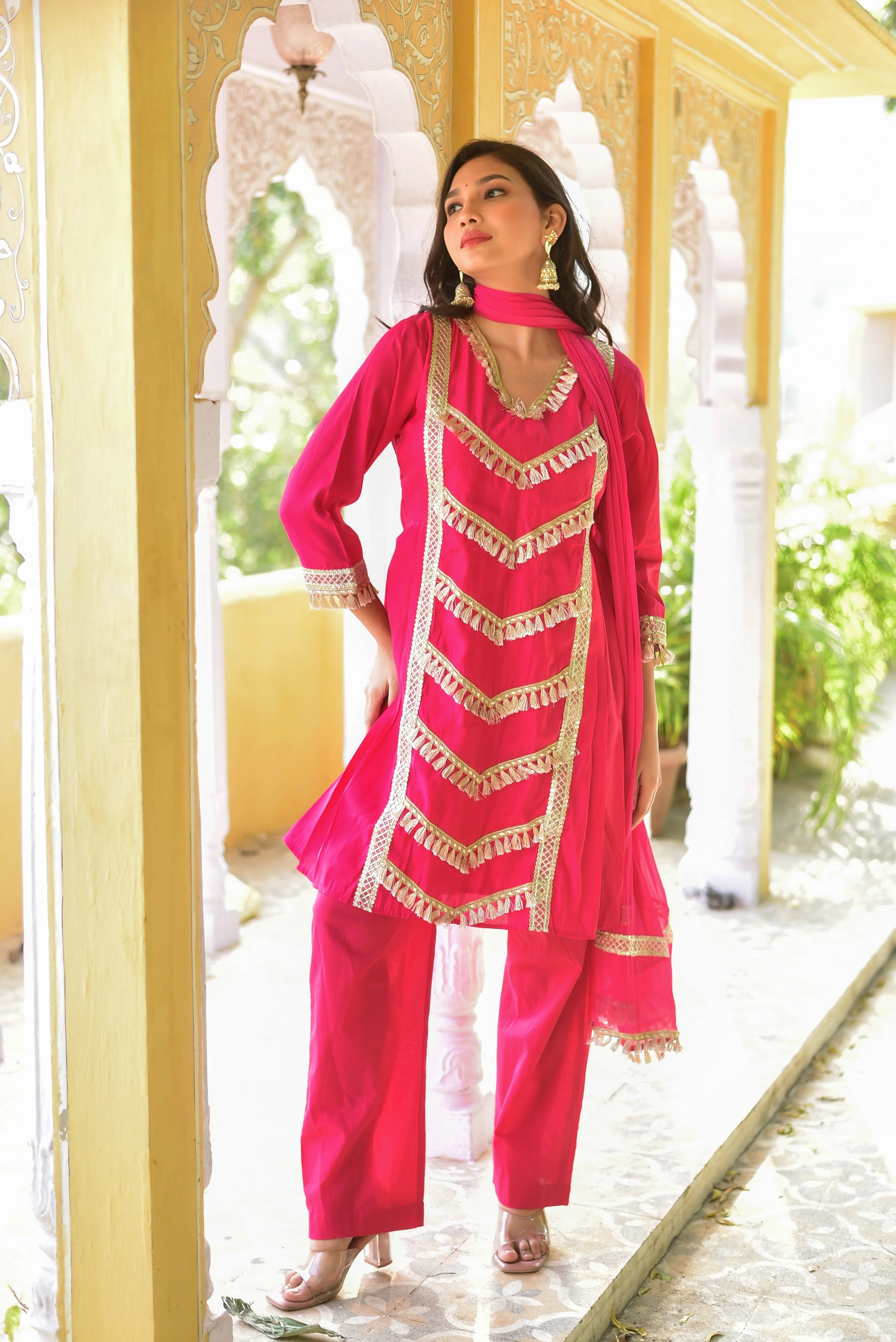 Stunning Peony Pink Kurta & Pant Set: Elevate Your Festive Style

This exquisite ensemble is a perfect blend of vibrant color and intricate craftsmanship, making it a standout piece for any occasion. The peony pink hue exudes elegance and sophistication, while the intricate details and patterns add a touch of traditional charm. The kurta's V-neck and three-quarter sleeves create a flattering silhouette, and the pants' straight-leg design ensures comfort without compromising on style.