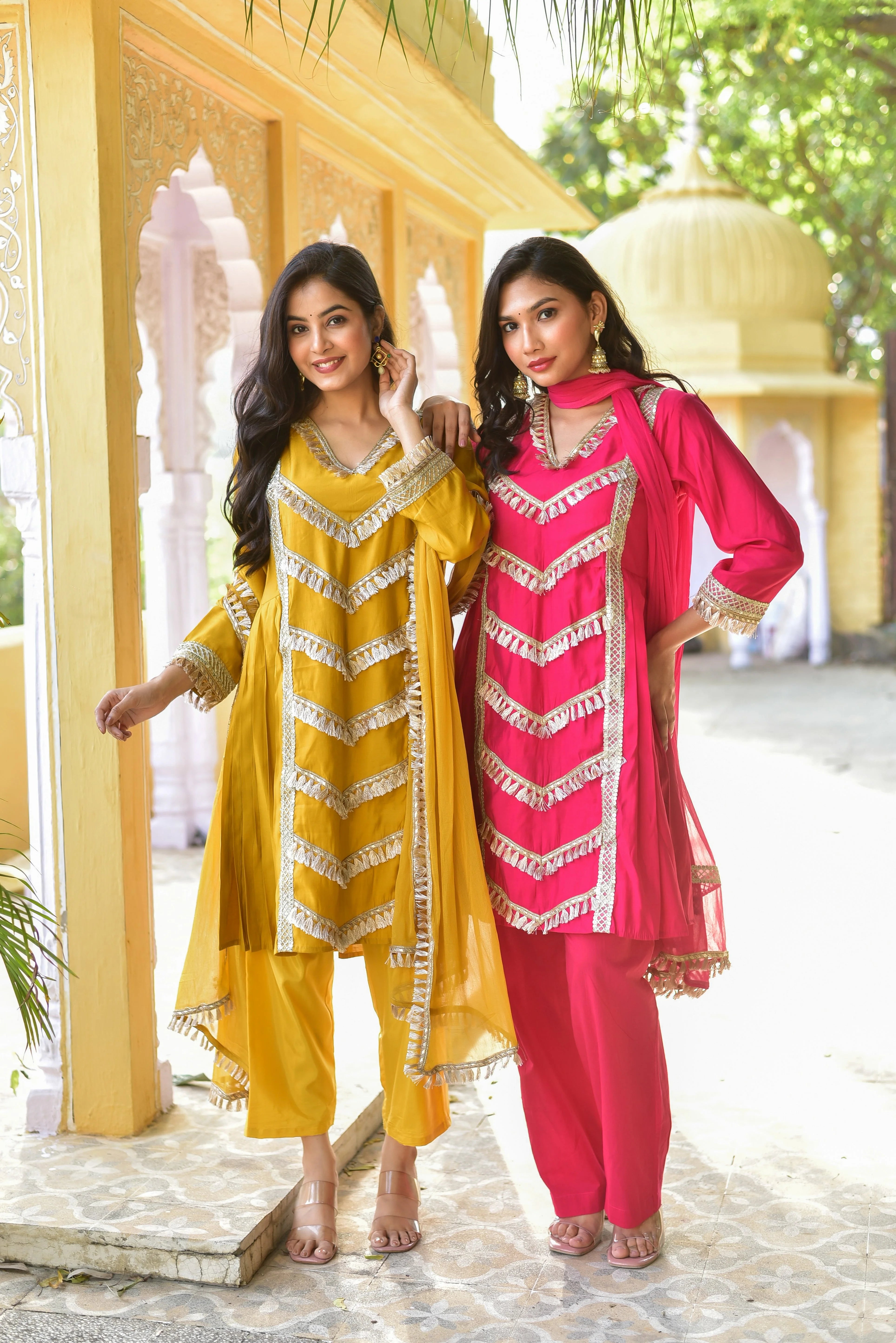 The Peony Pink Kurta & Pant Set is a stunning ensemble that exudes elegance and sophistication. The vibrant peony pink hue is complemented by intricate gold accents, creating a striking visual effect. The kurta features a classic A-line silhouette with a V-neckline and 3/4 sleeves, while the matching pants provide a comfortable and stylish fit. The set is completed with a flowing dupatta that adds a touch of drama to the overall look.