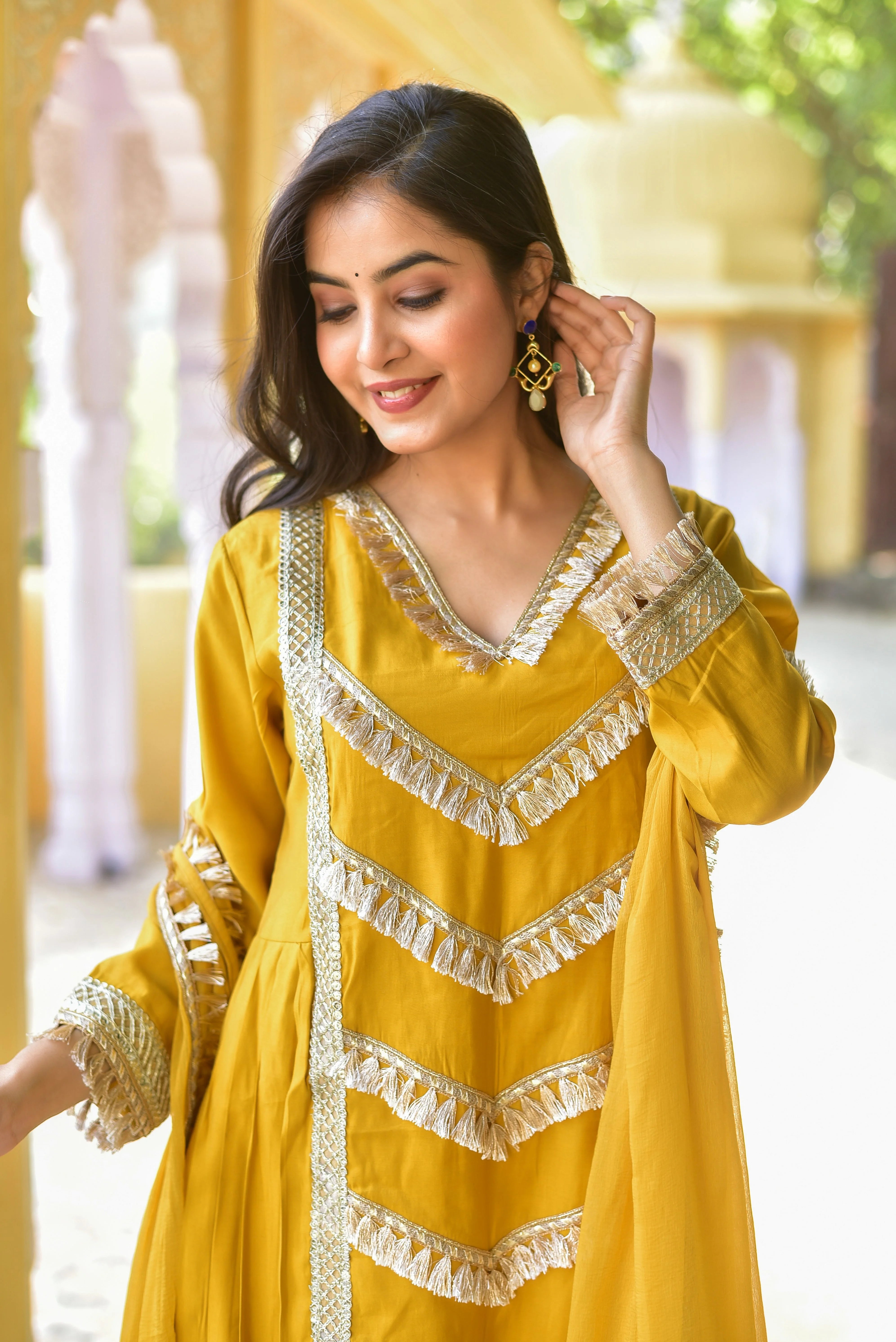 This stunning Yellow Gold Kurta & Pant Set is a vibrant celebration of traditional Indian elegance, perfect for the modern woman who values both heritage and contemporary style. Crafted with meticulous attention to detail, this ensemble is a true masterpiece of Indian fashion.

The set features a rich, golden yellow hue that exudes warmth and sophistication, complemented by intricate gold accents that add a touch of opulence.