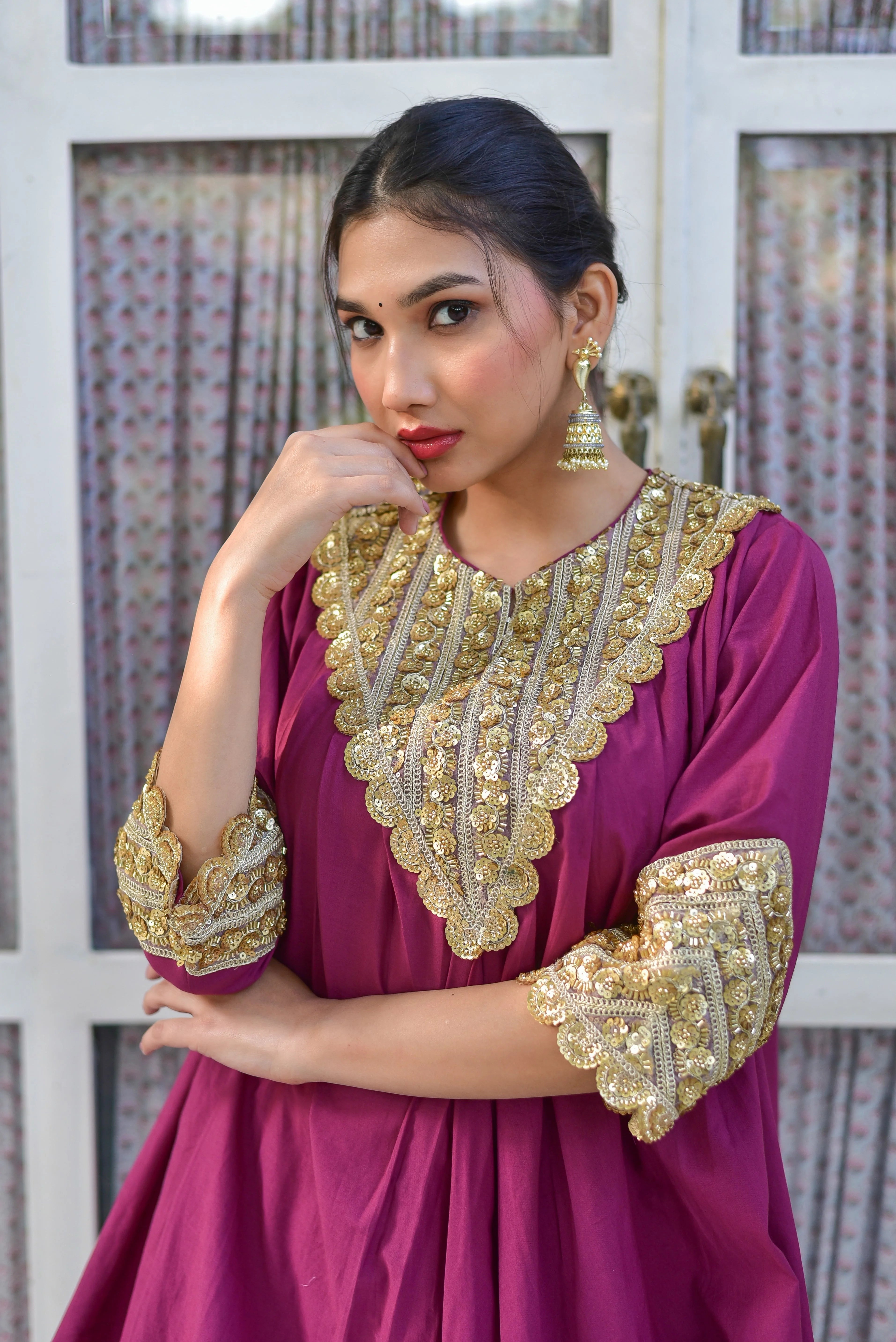 The Mulberry Gold Glaze Co-Ord Set is a stunning ensemble that exudes effortless elegance. Crafted from 100% pure cotton, this luxurious set features a rich mulberry hue and intricate gold glaze details, creating a timeless and sophisticated look. The set's contemporary silhouette is both comfortable and breathable, making it perfect for any occasion. With its elegant design and high-quality materials, this co-ord set is sure to make a statement and turn heads.