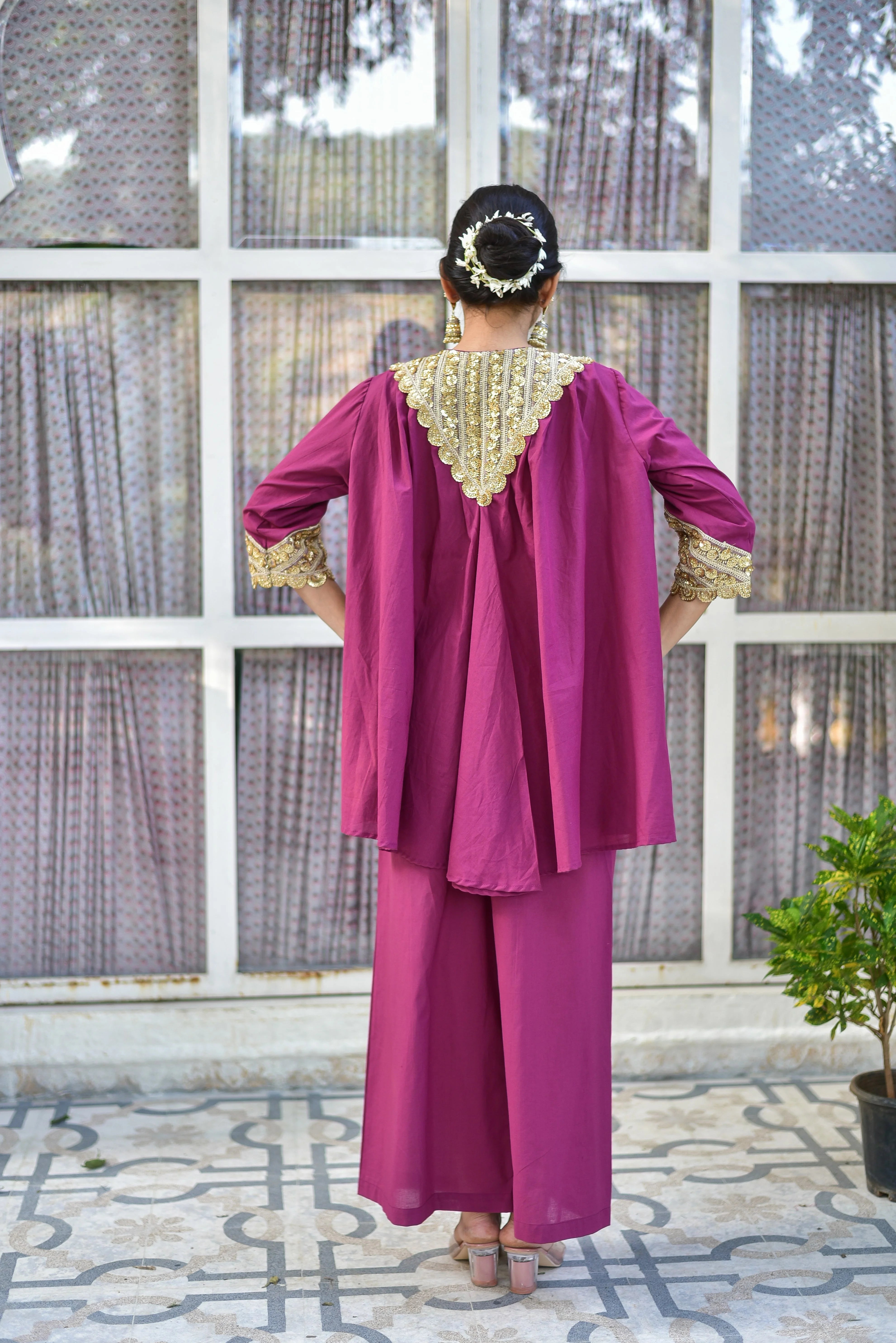 The Mulberry Gold Glaze Co-Ord Set is a stunning ensemble that exudes elegance and sophistication. Crafted from 100% pure cotton, this luxurious set features a beautiful mulberry color with intricate gold glaze details that add a touch of glamour to any occasion. The set includes a top and bottom, both designed with a contemporary silhouette that drapes beautifully while ensuring all-day comfort and breathability.