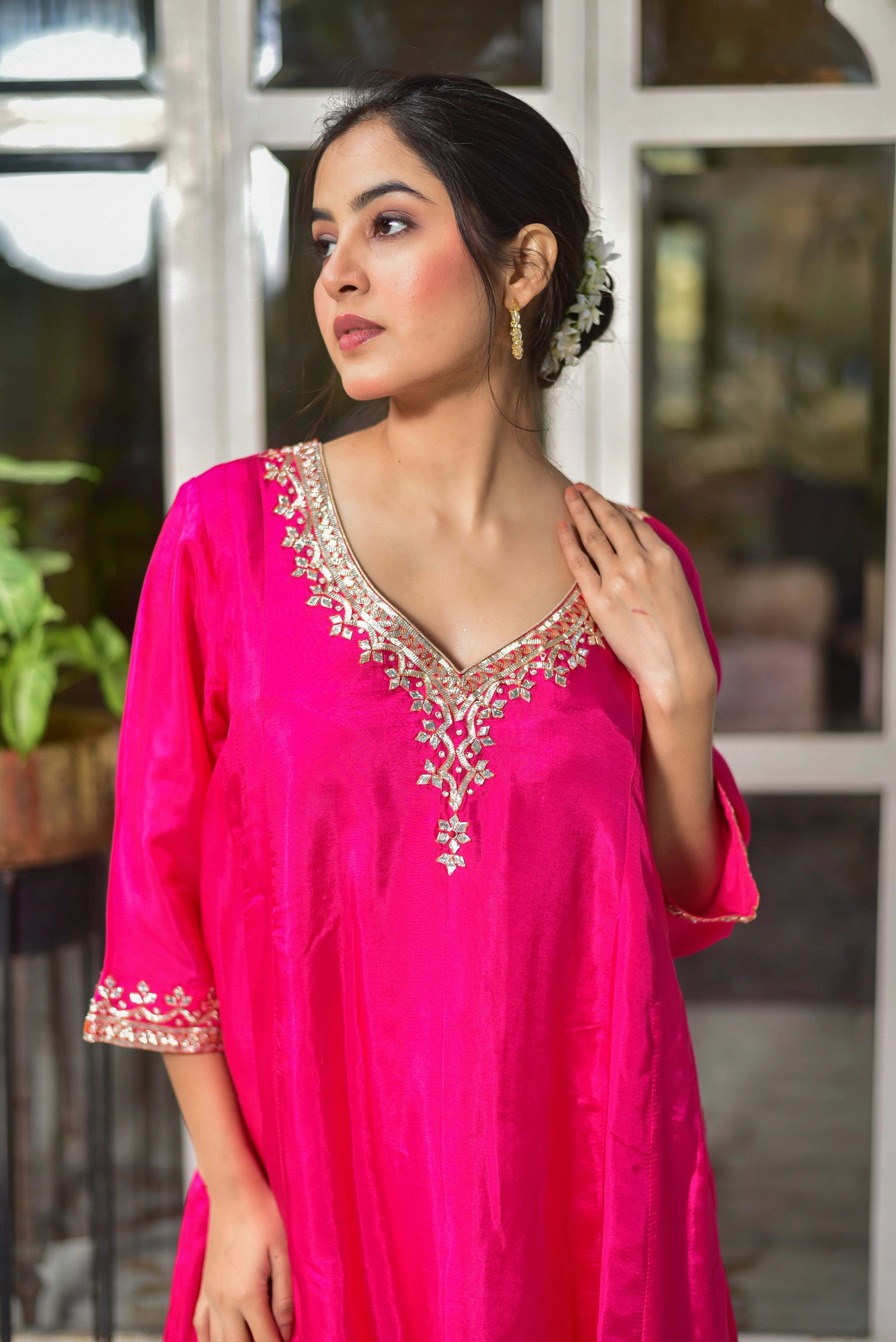 This Rani Pink Punjabi Style Kurta & Dhoti Set exudes traditional elegance with its vibrant pink hue and luxurious silk fabric. The intricate embroidery on the kurta adds a touch of sophistication, while the flowing dhoti pants complete the regal ensemble. Perfect for special occasions or cultural events, this set embodies the essence of Punjabi style with its vibrant color and elegant design.