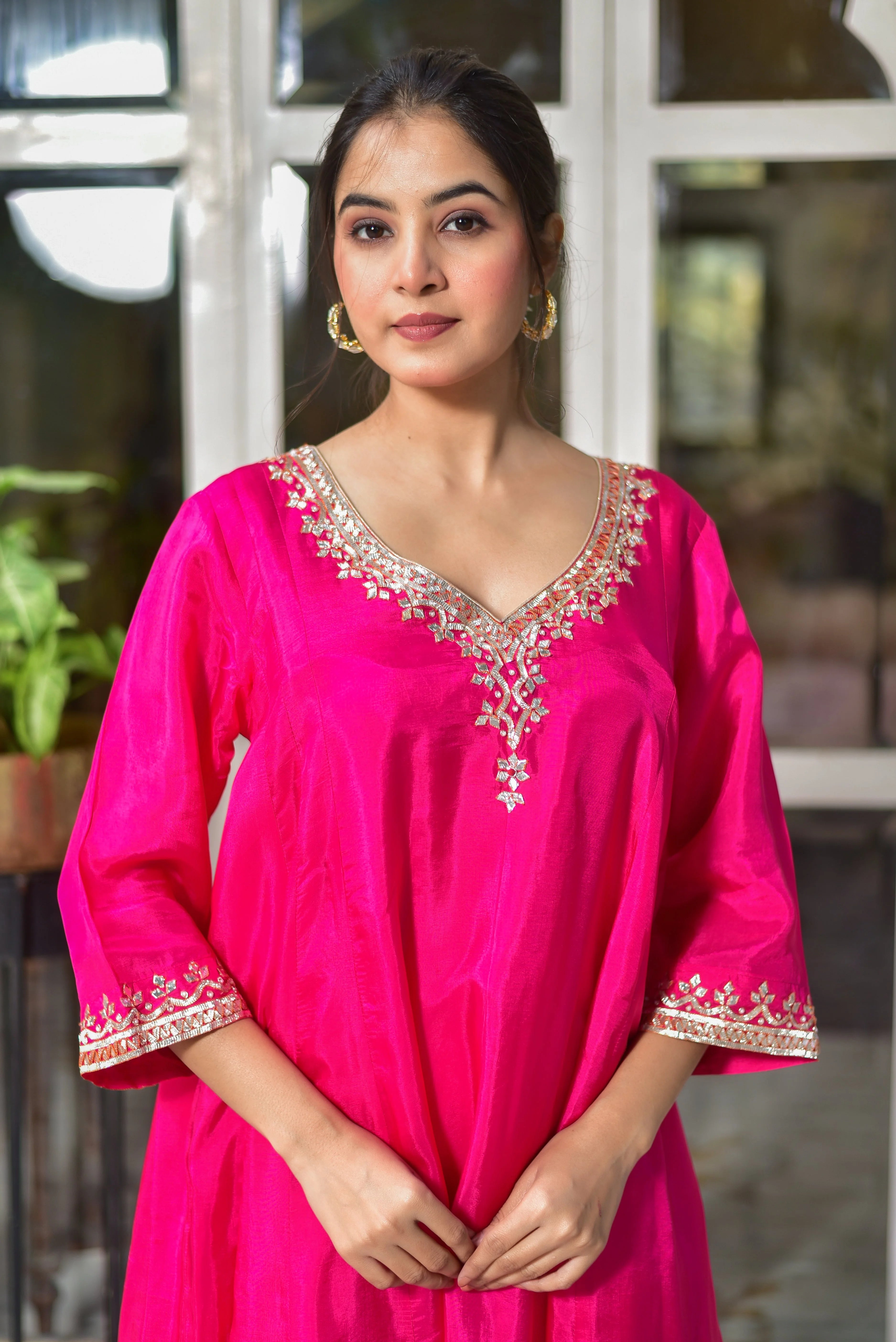 The Rani Pink Punjabi Style Kurta & Dhoti Set is a stunning ensemble that exudes elegance and tradition. Crafted from luxurious silk, this set features a vibrant rani pink color and intricate embroidery that adds a touch of sophistication to the overall design.

The kurta boasts a fluid silhouette that drapes beautifully on the body, making it perfect for formal occasions or cultural events.