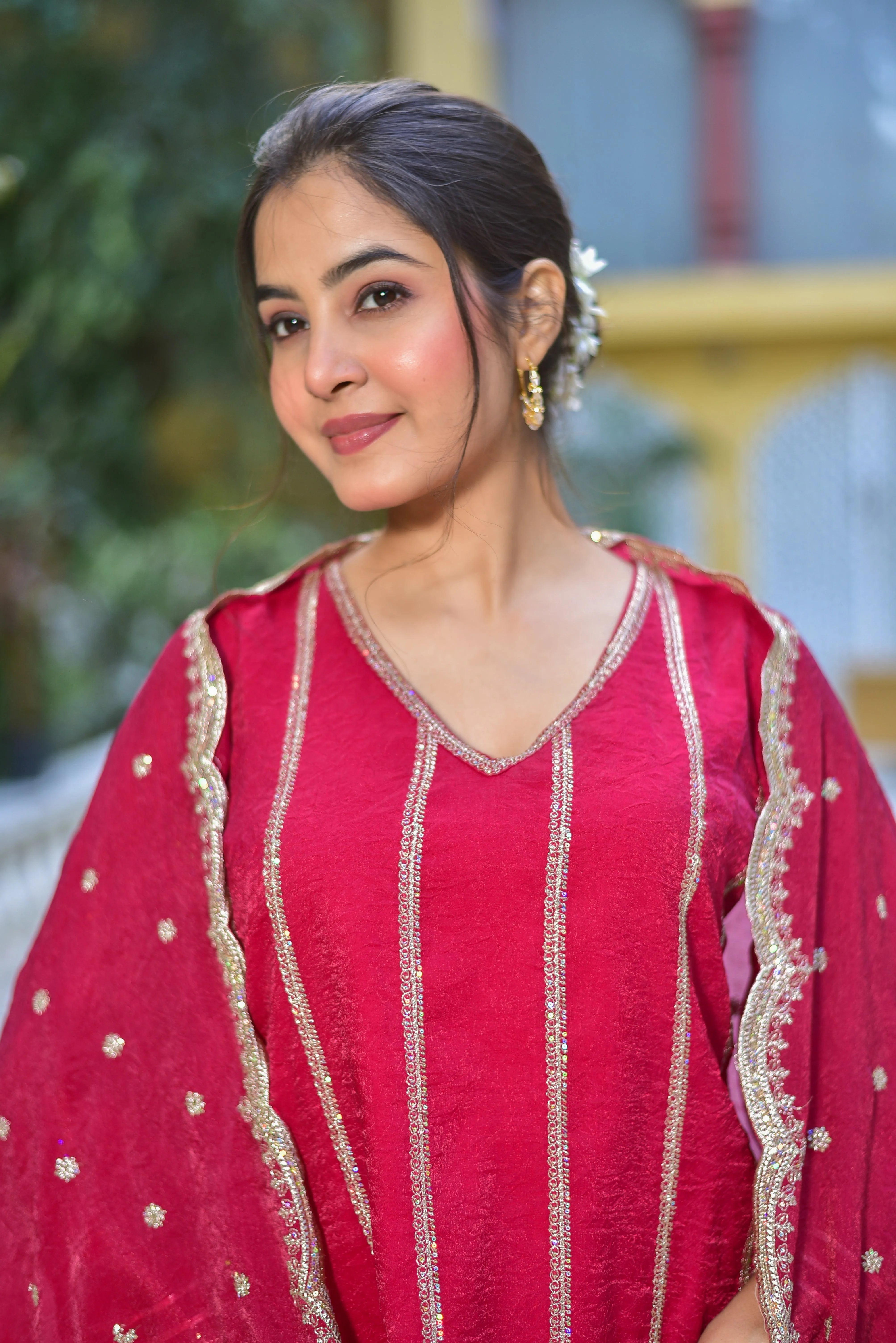 The Magenta Heavy Sharara Set is a stunning ensemble that exudes elegance and sophistication. Crafted from rich, heavy fabric, this set features intricate embroidery that adds a touch of luxury to its overall design. The magenta hue is vibrant and eye-catching, making it perfect for festive occasions and special gatherings.

The set includes a long-sleeved kurta with a V-neckline, a flared sharara, and a matching dupatta with delicate embroidery.