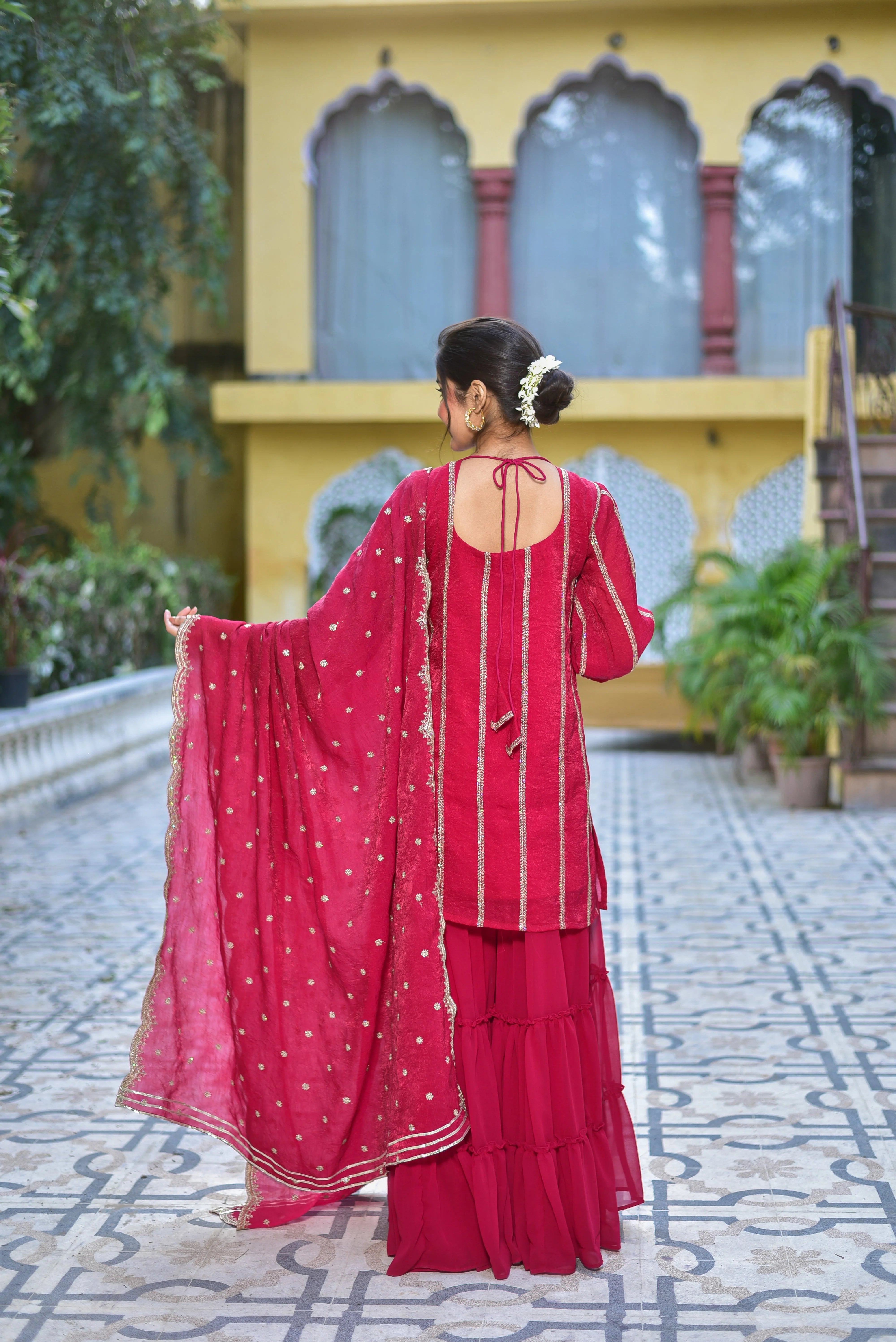 The Magenta Heavy Sharara Set: A Timeless Elegance for Festive Occasions

This exquisite ensemble is a celebration of artisanal craftsmanship and regal sophistication. Crafted from high-quality magenta fabric, the set features intricate details and a stylish design that exudes elegance and poise. Perfect for festive occasions, celebrations, and special gatherings, this set is a must-have for any woman who appreciates the finer details.
