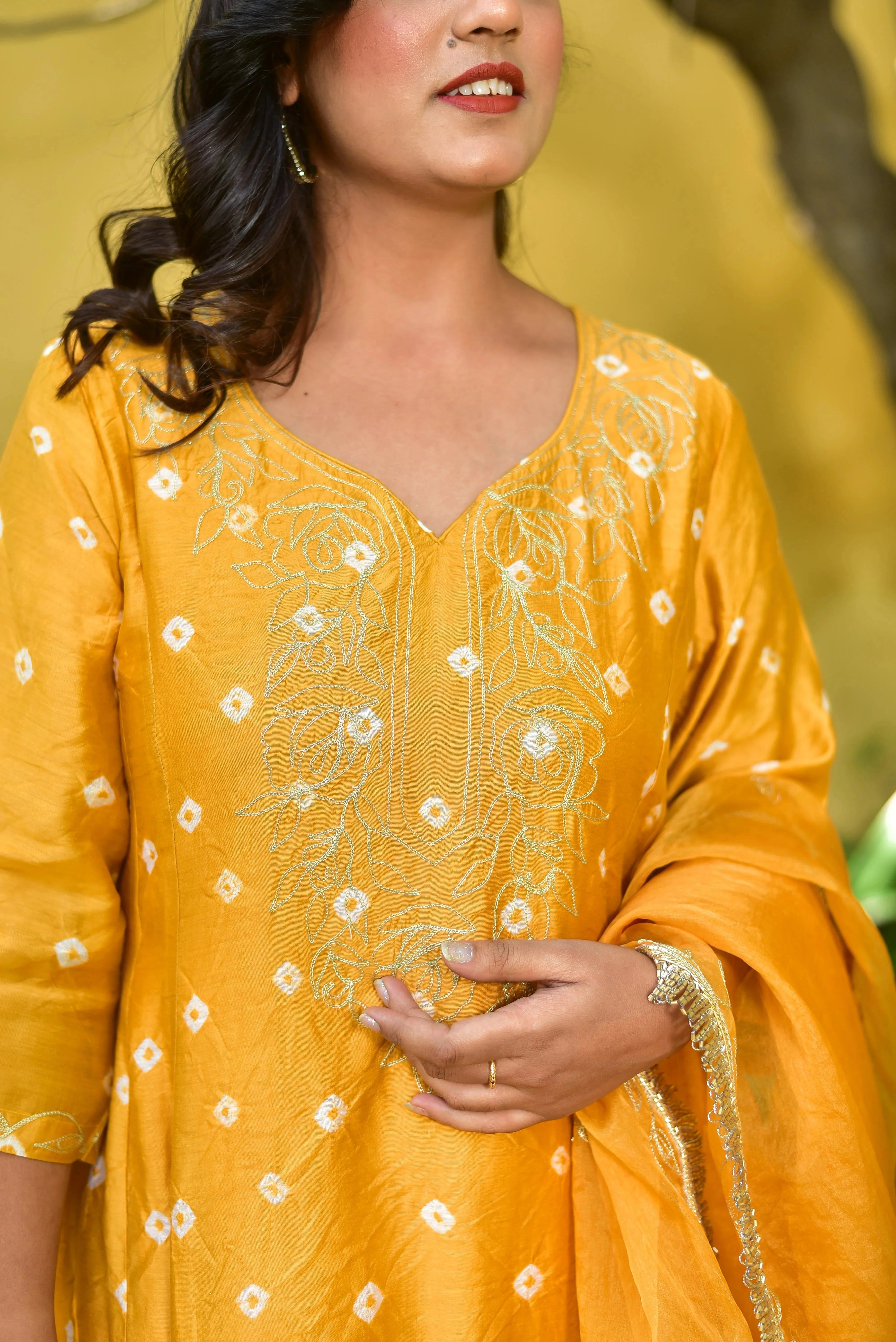 The Mustard Yellow Bhandej Kurta Set is a stunning ensemble that embodies the essence of traditional bandhani craftsmanship and vibrant elegance. The luminous mustard hue captures the essence of sunshine and joy, making it perfect for auspicious occasions and festive celebrations.

This exquisite set features a beautifully crafted kurta with intricate bandhani work, showcasing the rich heritage of Indian textiles.