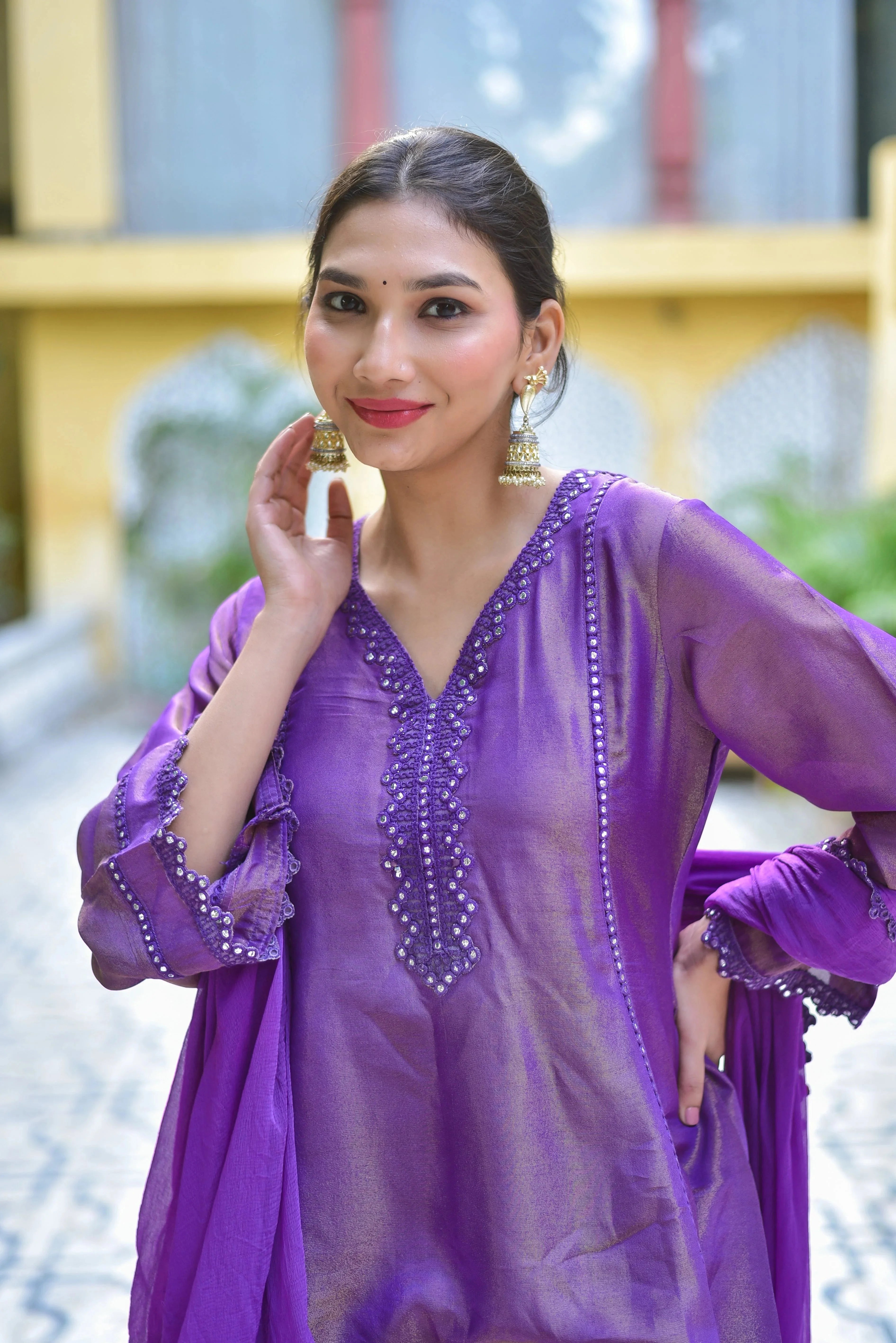 The Purple Zari Silk Kurta Sharara Set is a masterpiece of traditional Indian craftsmanship and contemporary elegance, perfect for women who appreciate regal luxury. This stunning ensemble is ideal for festive occasions, celebrations, and special gatherings.

Key Features:

   Fabric: Luxurious Zari Silk, known for its rich texture and vibrant color.
   Design: Elegant purple hue with intricate zari embroidery, adding a touch of sophistication to the wearer.