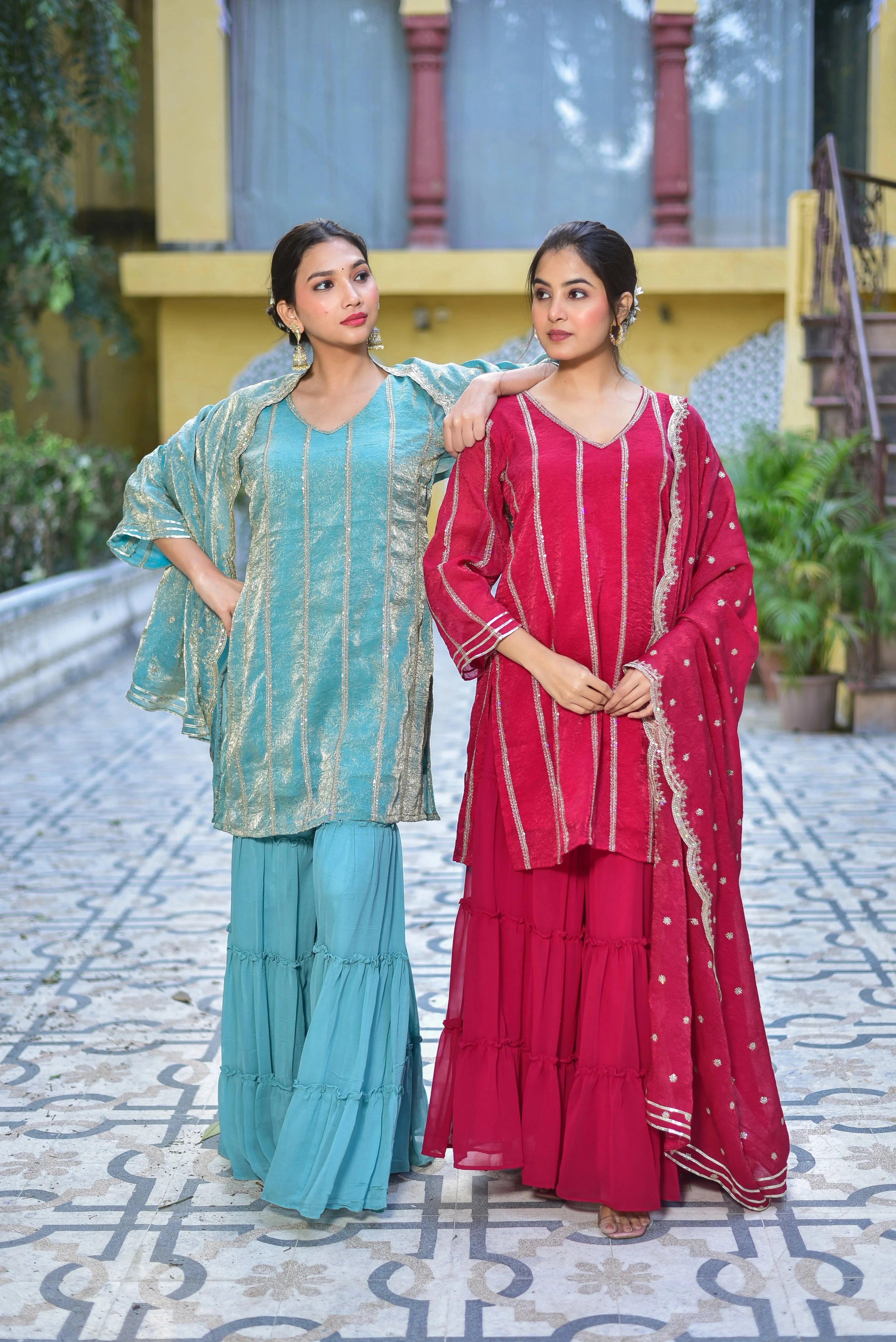 The Magenta Heavy Sharara Set is a stunning ensemble that embodies elegance and sophistication. The intricate details of the fabric, style, and fit are showcased in this exquisite piece, making it perfect for festive occasions and special gatherings. With its regal charm and artisanal craftsmanship, this set is sure to turn heads and make a statement. Experience the epitome of fashion with this timeless and trendy piece that's sure to elevate your style game.