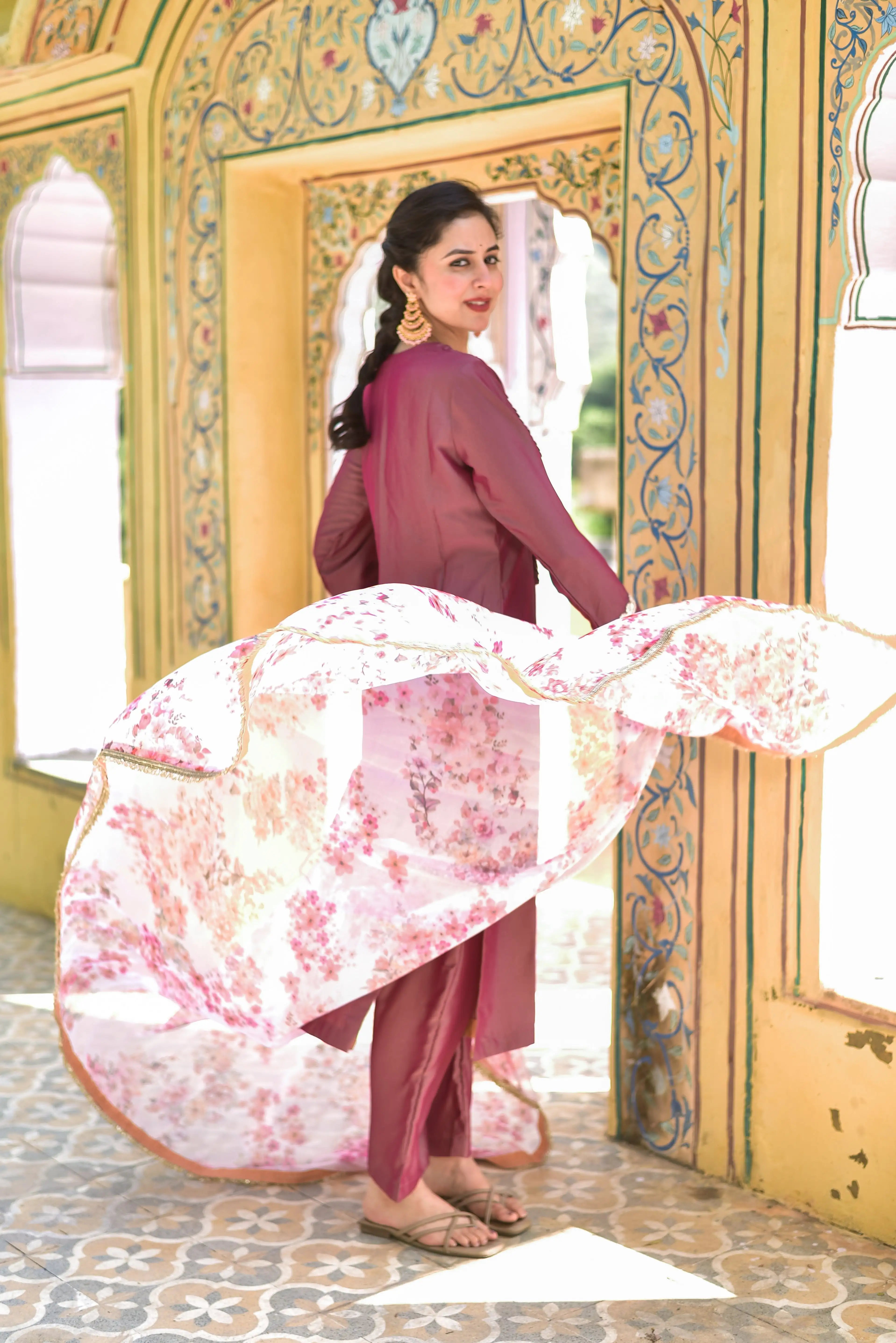 The Onion Pink Kurta & Pant Set is a stunning ensemble that exudes elegance and sophistication. The rich peacock blue hue of the kurta and pant is complemented by an exquisite floral dupatta, adding a touch of artistic elegance to the overall look. The intricate floral pattern on the dupatta brings a sense of traditional Indian heritage, while the delicate fabric drapes beautifully around the body.

This set is perfect for making a regal statement at any occasion, from formal events to everyday wear.