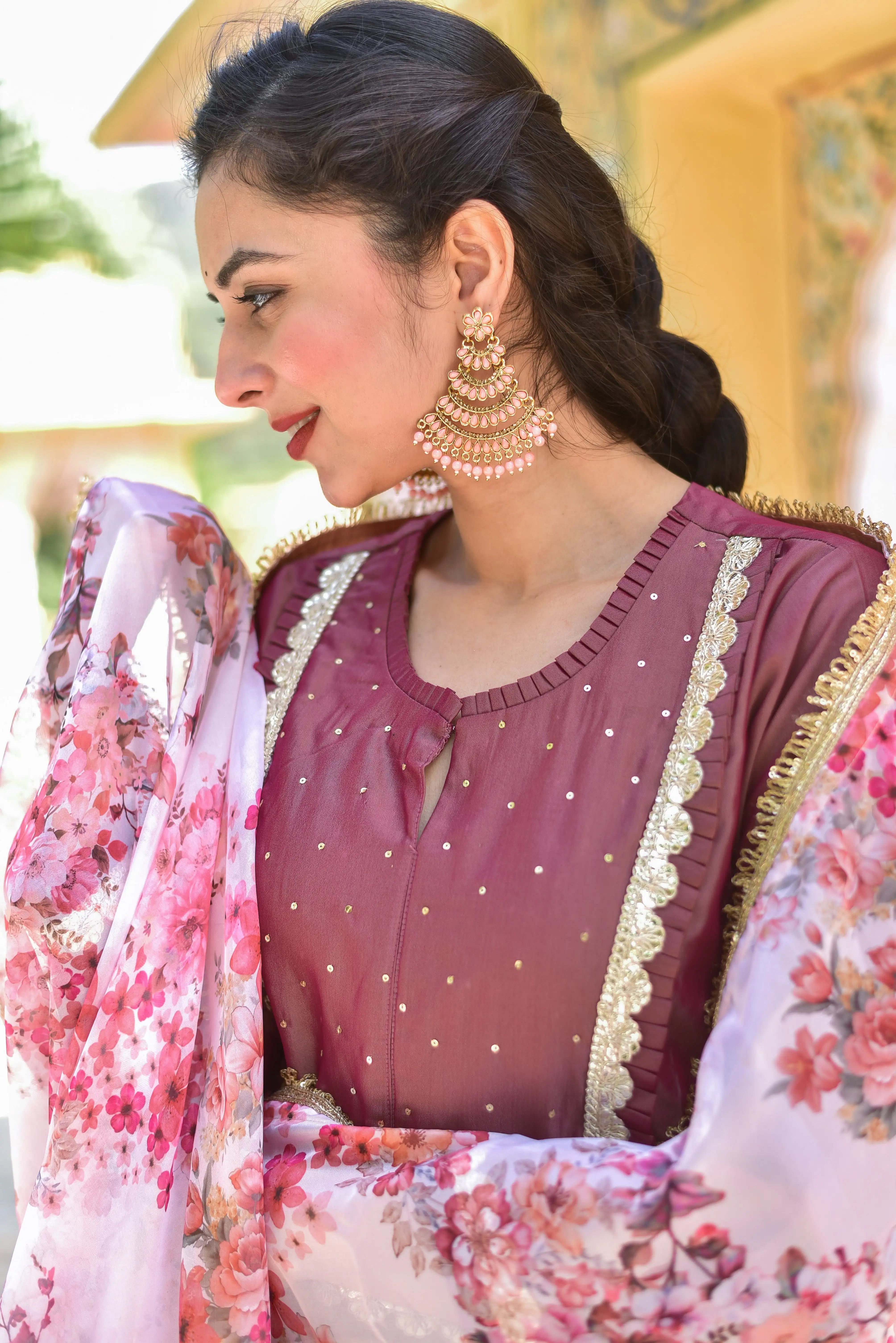 The Onion Pink Kurta & Pant Set is a stunning and elegant ensemble that exudes traditional Indian heritage with a modern twist. The rich peacock blue hue of the kurta and pant is a beautiful and regal color that evokes the majesty of Indian culture. The delicate floral dupatta adds a touch of artistic elegance to the outfit, creating a striking contrast with the bold and vibrant colors of the kurta and pant.