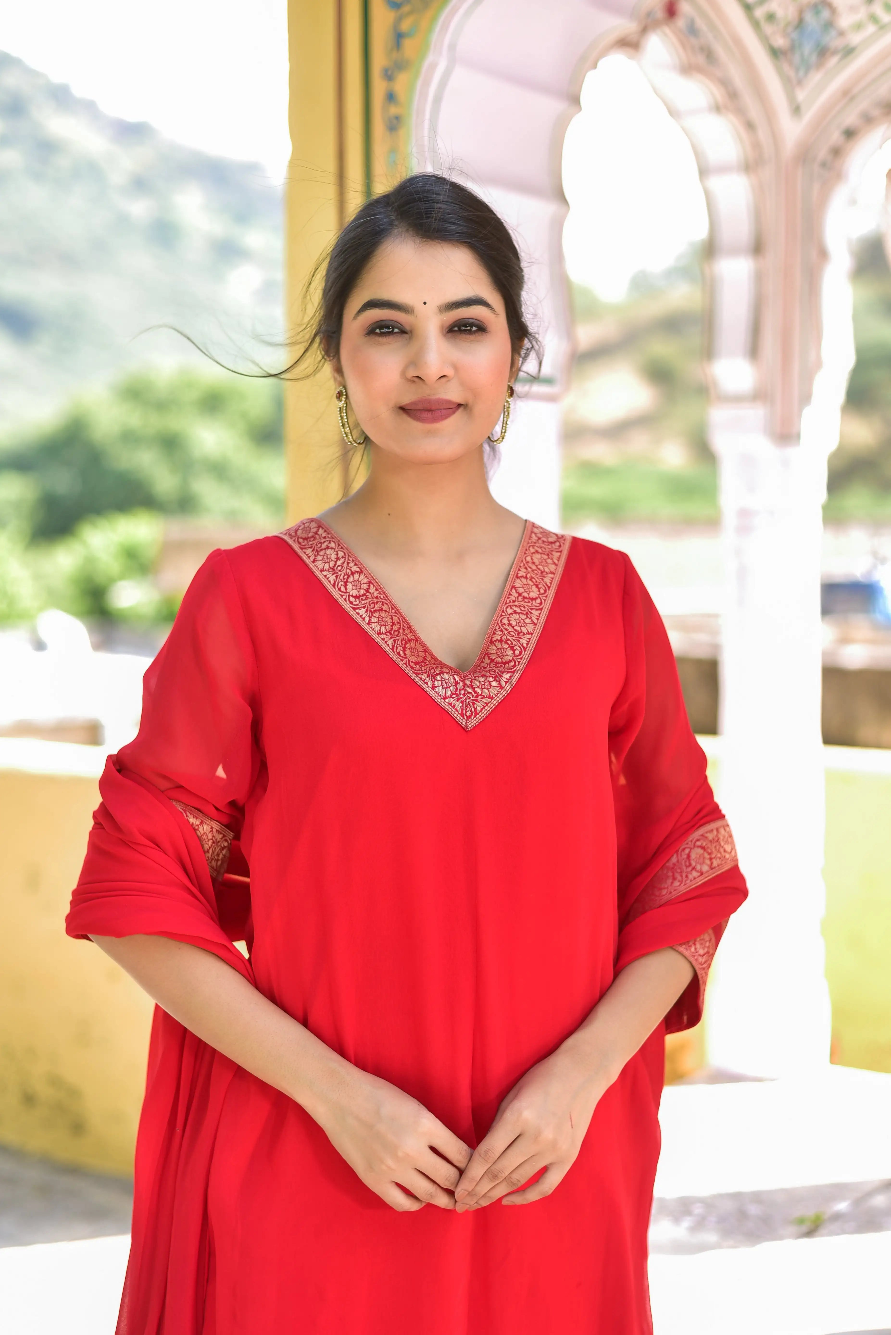 The Classic Red Brocade Kurta Set is a stunning ensemble that embodies traditional elegance and regal sophistication. The vibrant red hue, reminiscent of auspiciousness and joy, is complemented by intricate brocade detailing that adds a touch of royal grandeur to the overall design.

This exquisite set is crafted from luxurious fabric, ensuring both comfort and style. The kurta's classic silhouette is accentuated by the elegant brocade pattern, which adds a sophisticated touch to the outfit.