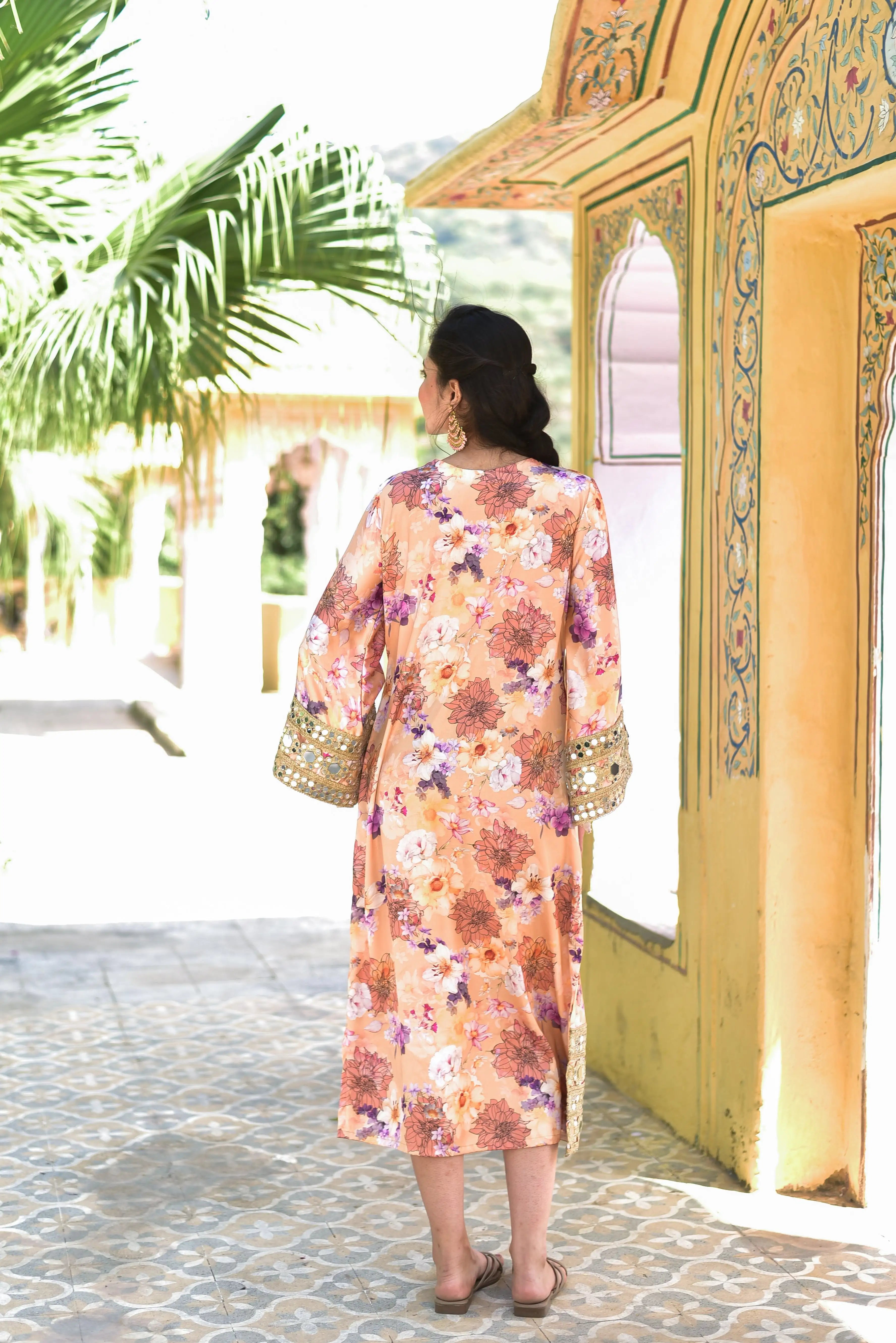 The Floral Mirage Satin Afghani Dress is a stunning piece of clothing that combines elegance and trendiness. The dress features a luxurious satin fabric adorned with vibrant digital floral prints, creating a visually appealing and eye-catching design. The mirror work embellishments add a touch of sophistication and glamour, catching the light with every movement.

This dress is perfect for those who want to make a statement with their fashion choices.